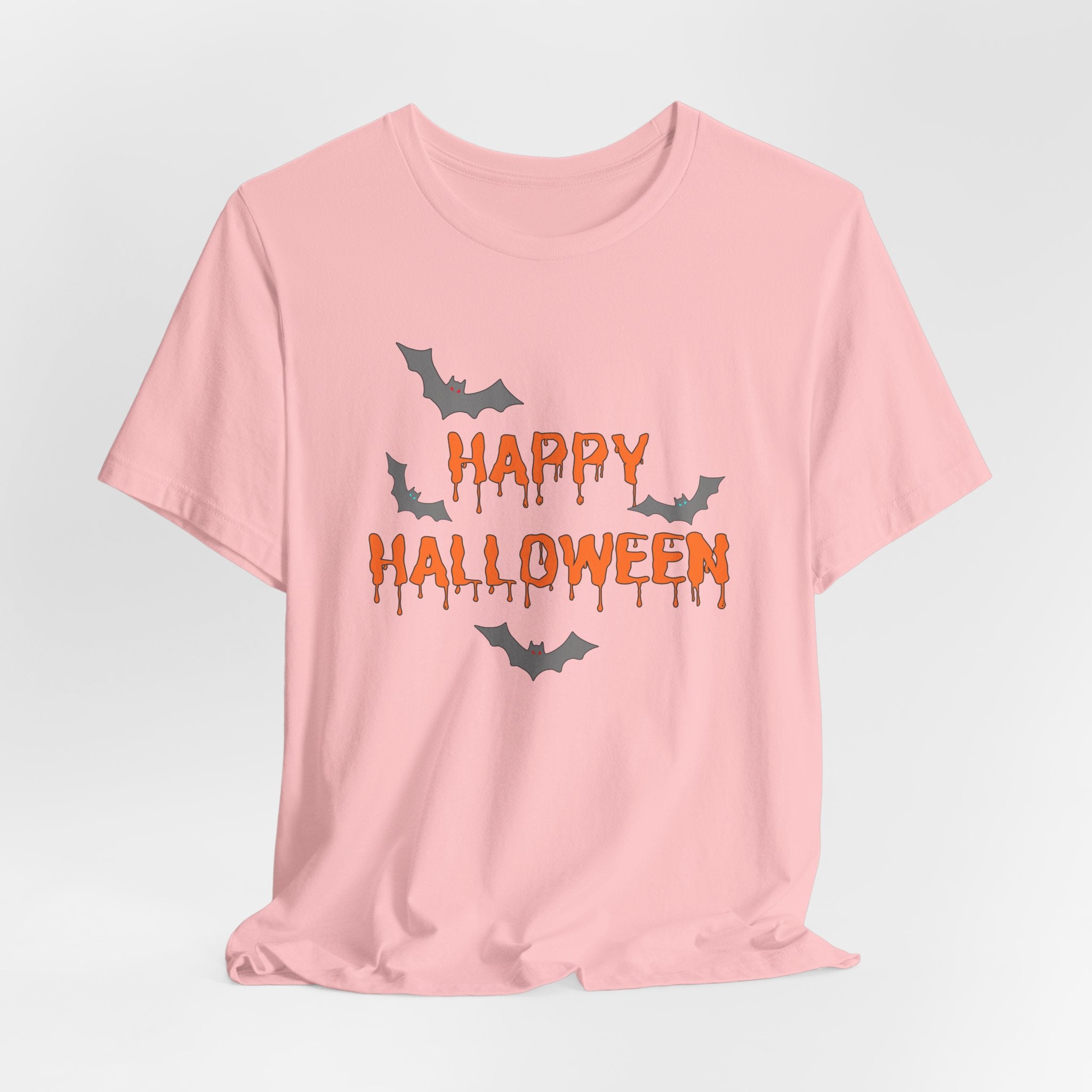 Pink t-shirt with 'Happy Halloween' text and bats on a light gray background