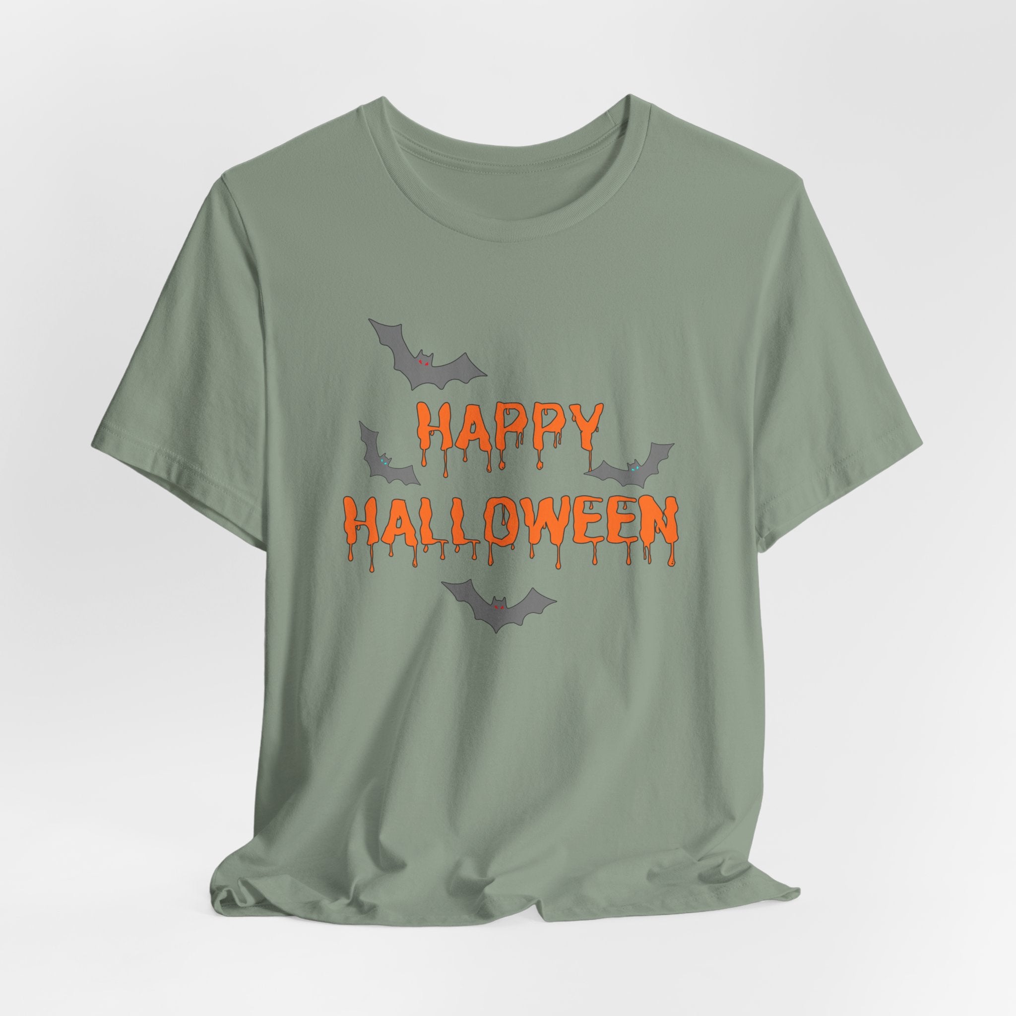 Sage green t-shirt with 'Happy Halloween' text and bats on a light gray background