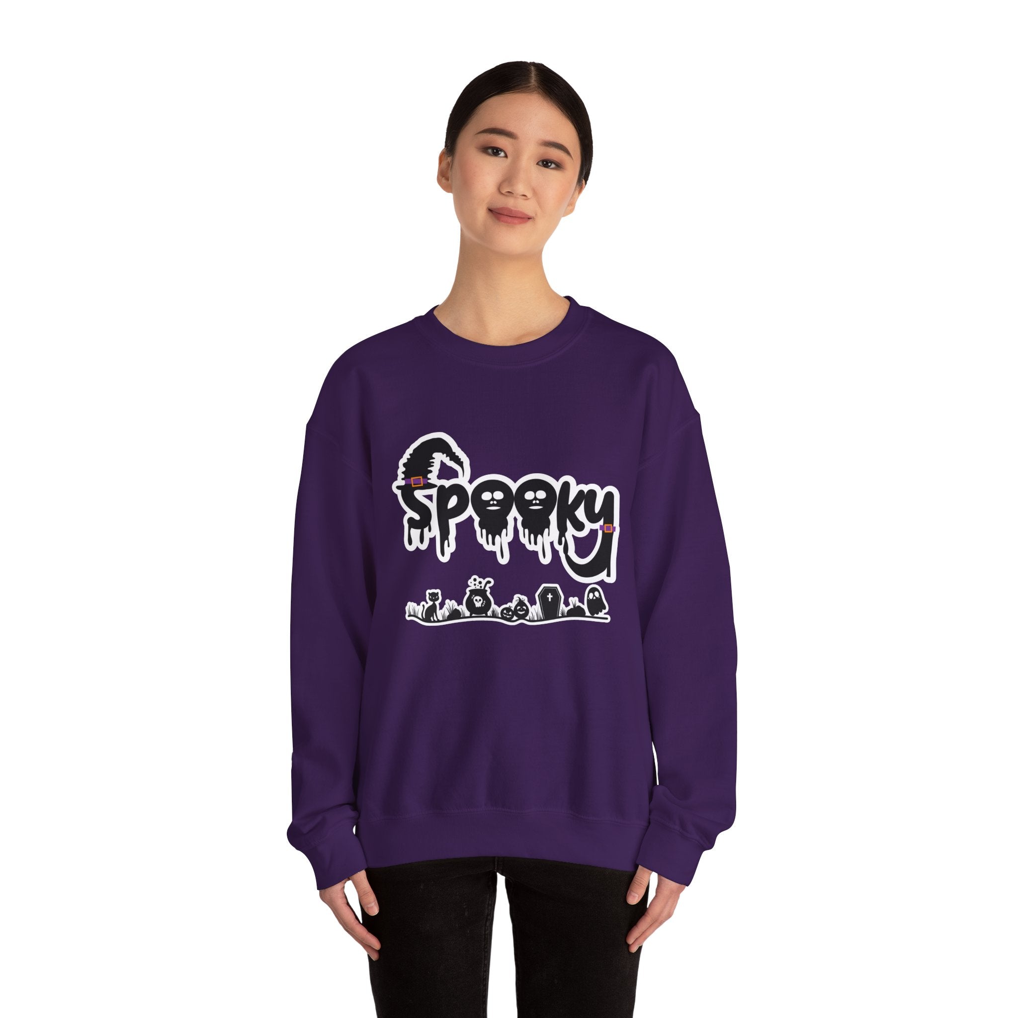 Person wearing a purple sweatshirt with a graphic design on a white background