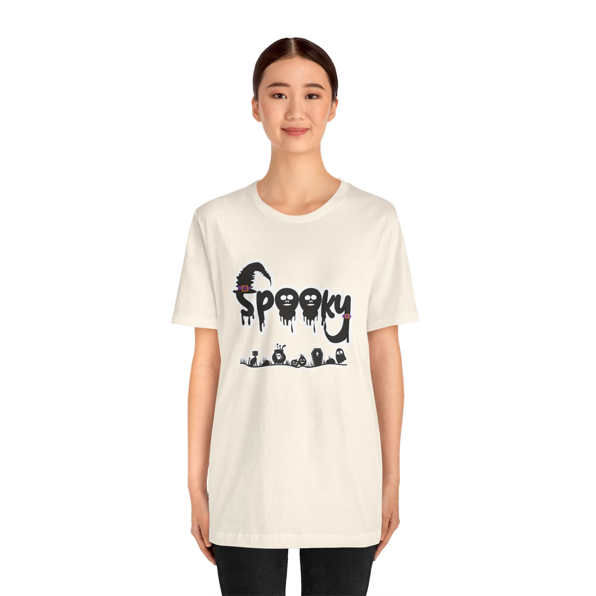 Person wearing a white t-shirt with 'Spooky' graphic design on a white background