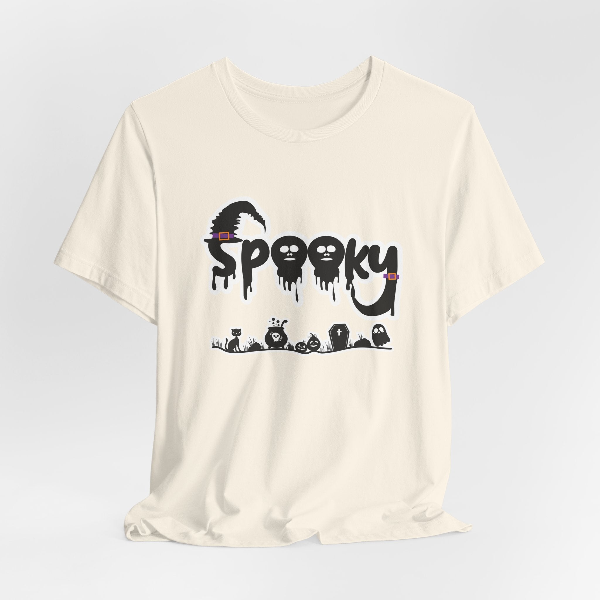 Ivory beige t-shirt with 'Spooky' halloween ghost, pumpkins, cat, and witch graphic design on a white background