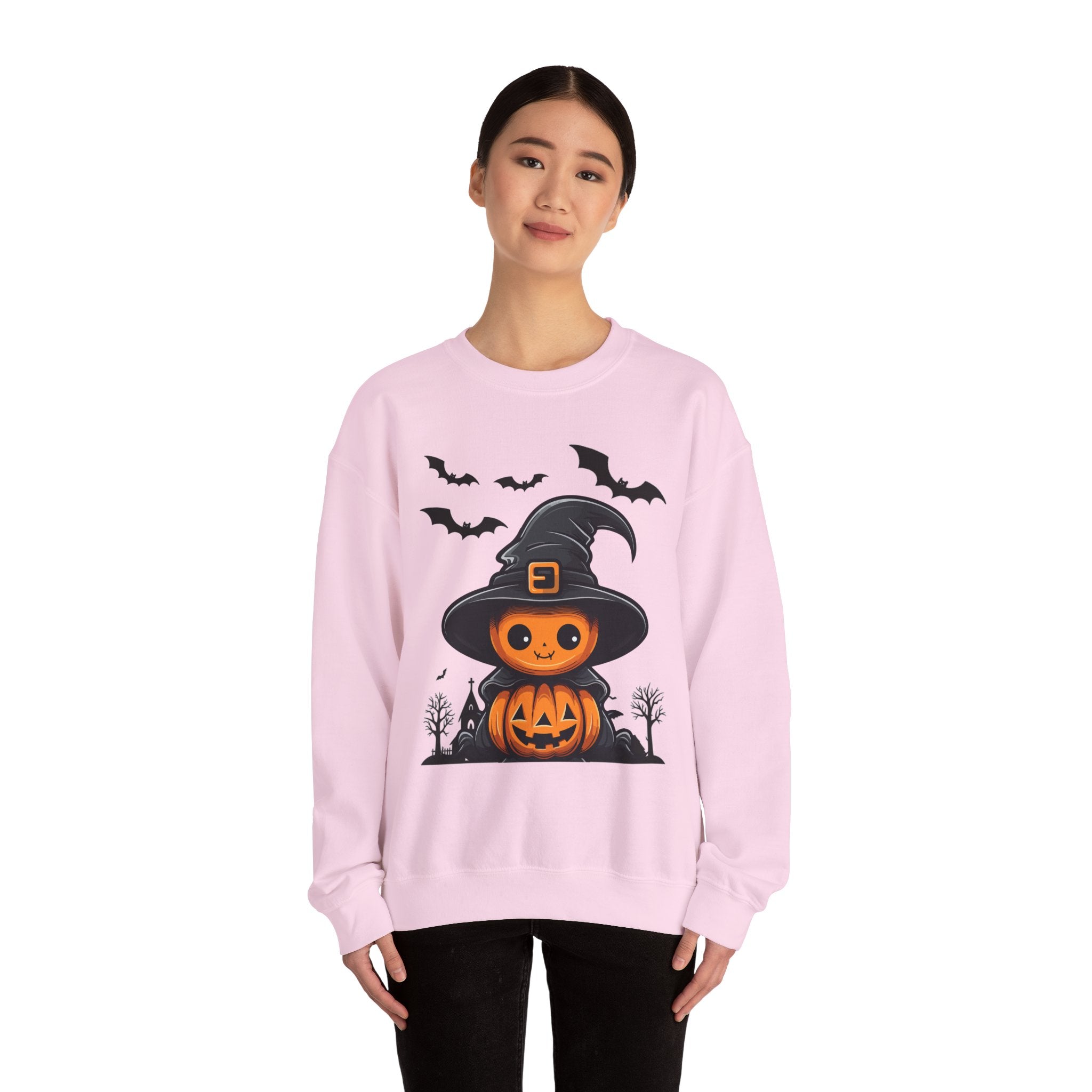 Person wearing a pink sweatshirt with Halloween design on a white background