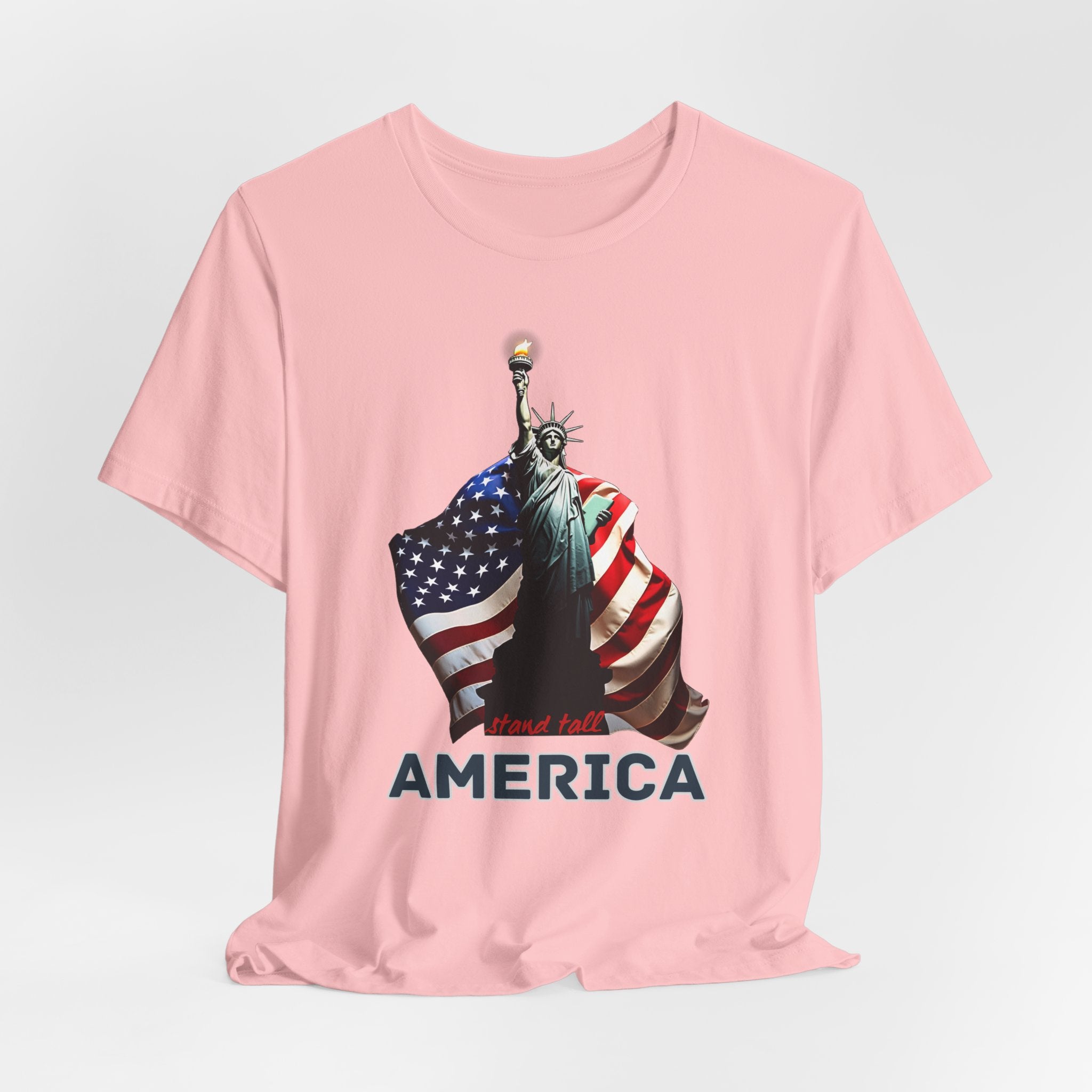 Pink t-shirt with Statue of Liberty and American flag design with stand stall America on a white background