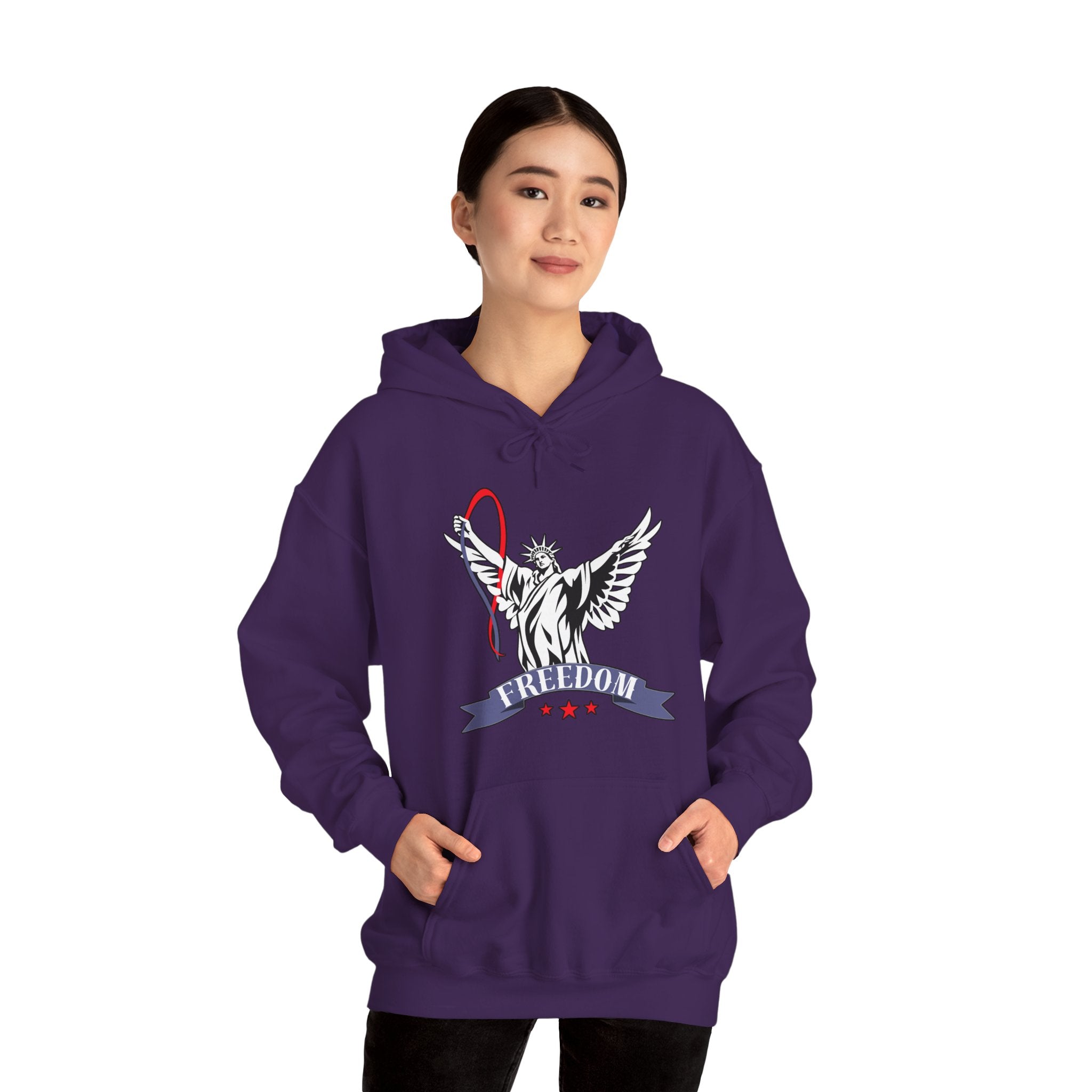 Person wearing a purple hoodie with a graphic of statue of liberty with wings design and freedom text on a white background