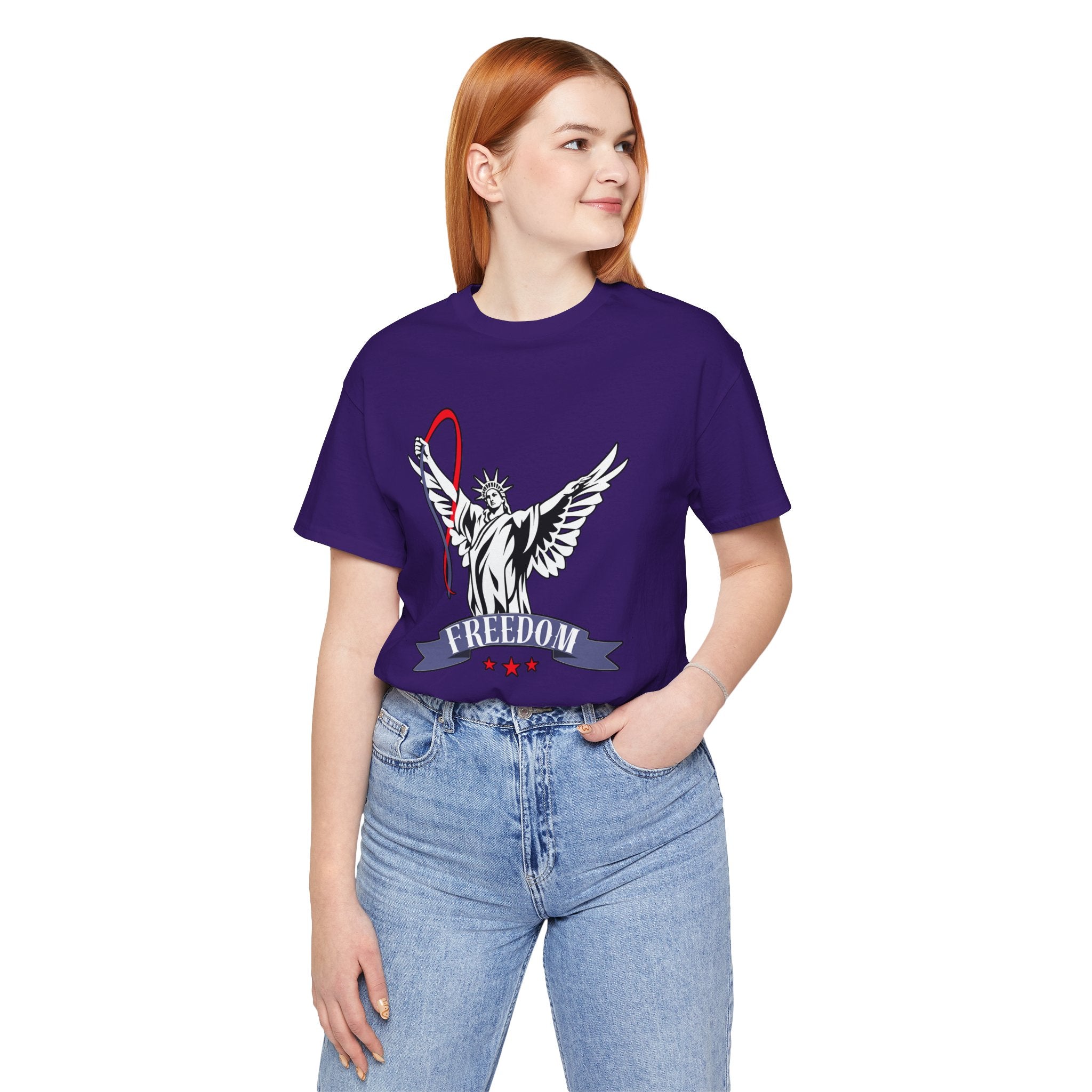 Person wearing a purple t-shirt with a graphic design and the word 'FREEDOM' on a white background