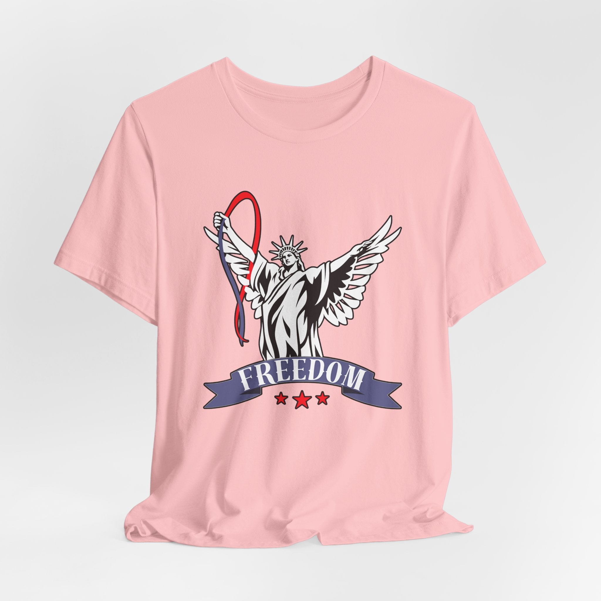 Pink t-shirt with a graphic design of the Statue of Liberty holding a banner with 'Freedom' on a light gray background.