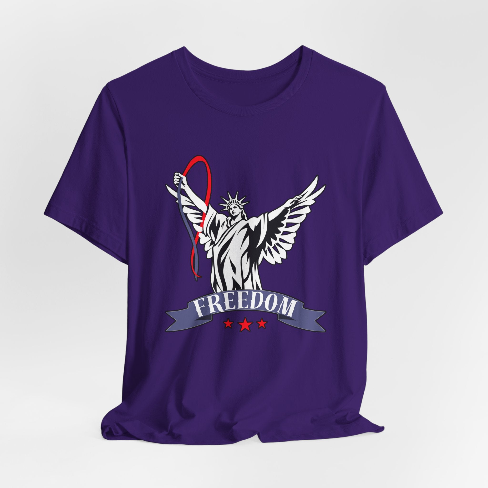 Team purple t-shirt with a graphic design of the Statue of Liberty holding a banner with 'Freedom' on a light gray background.