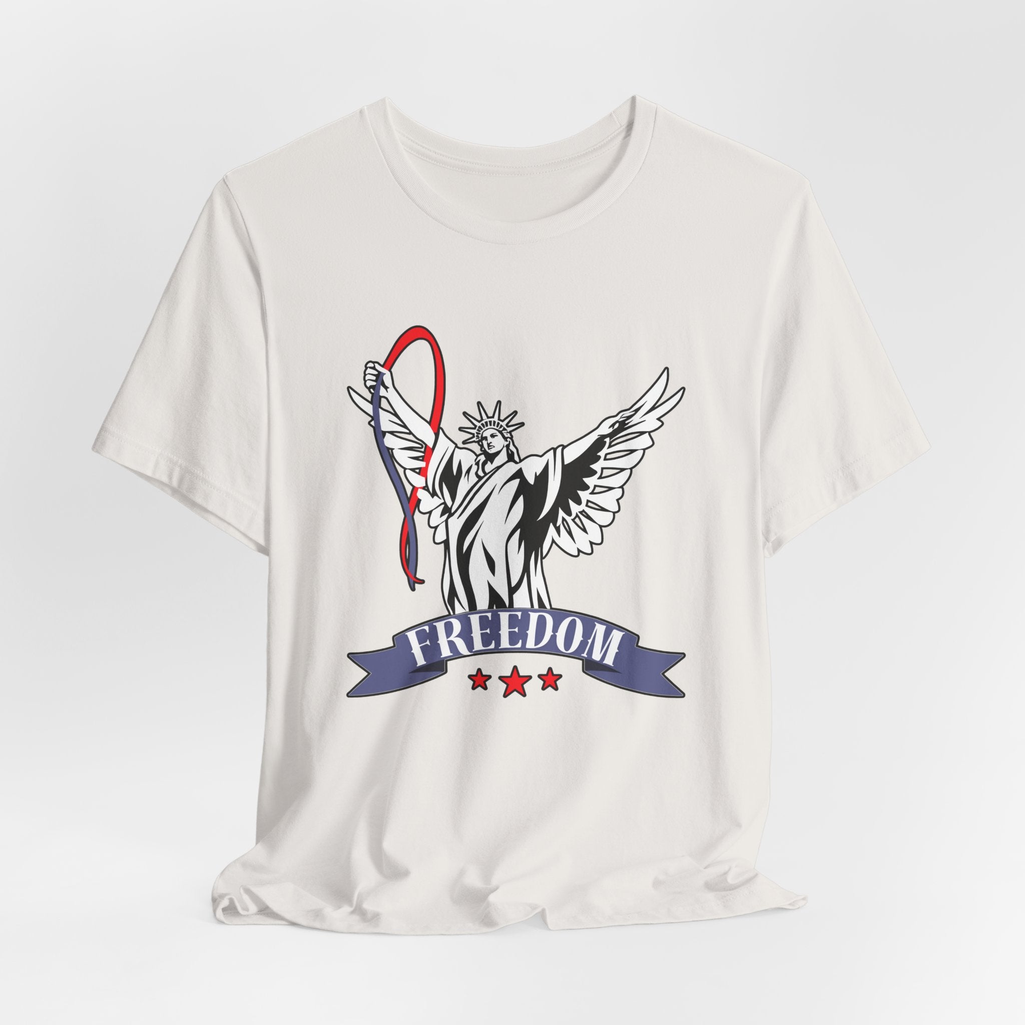 Vintage white t-shirt with a graphic design of the Statue of Liberty holding a banner with 'Freedom' on a light gray background.