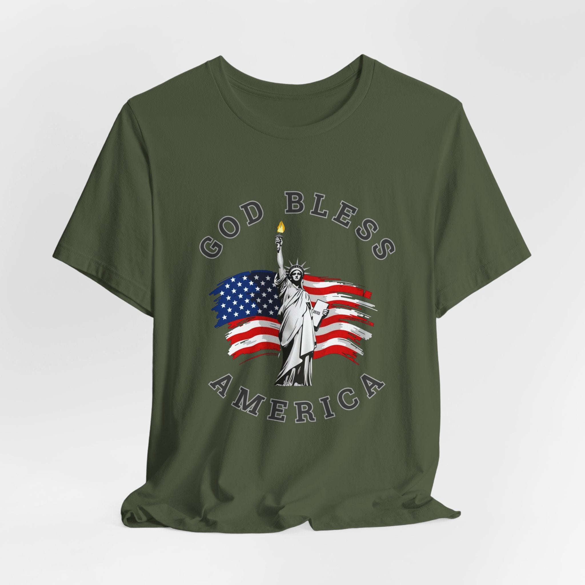 Military green t-shirt with 'God Bless America' graphic featuring the Statue of Liberty and American flag on a white background.