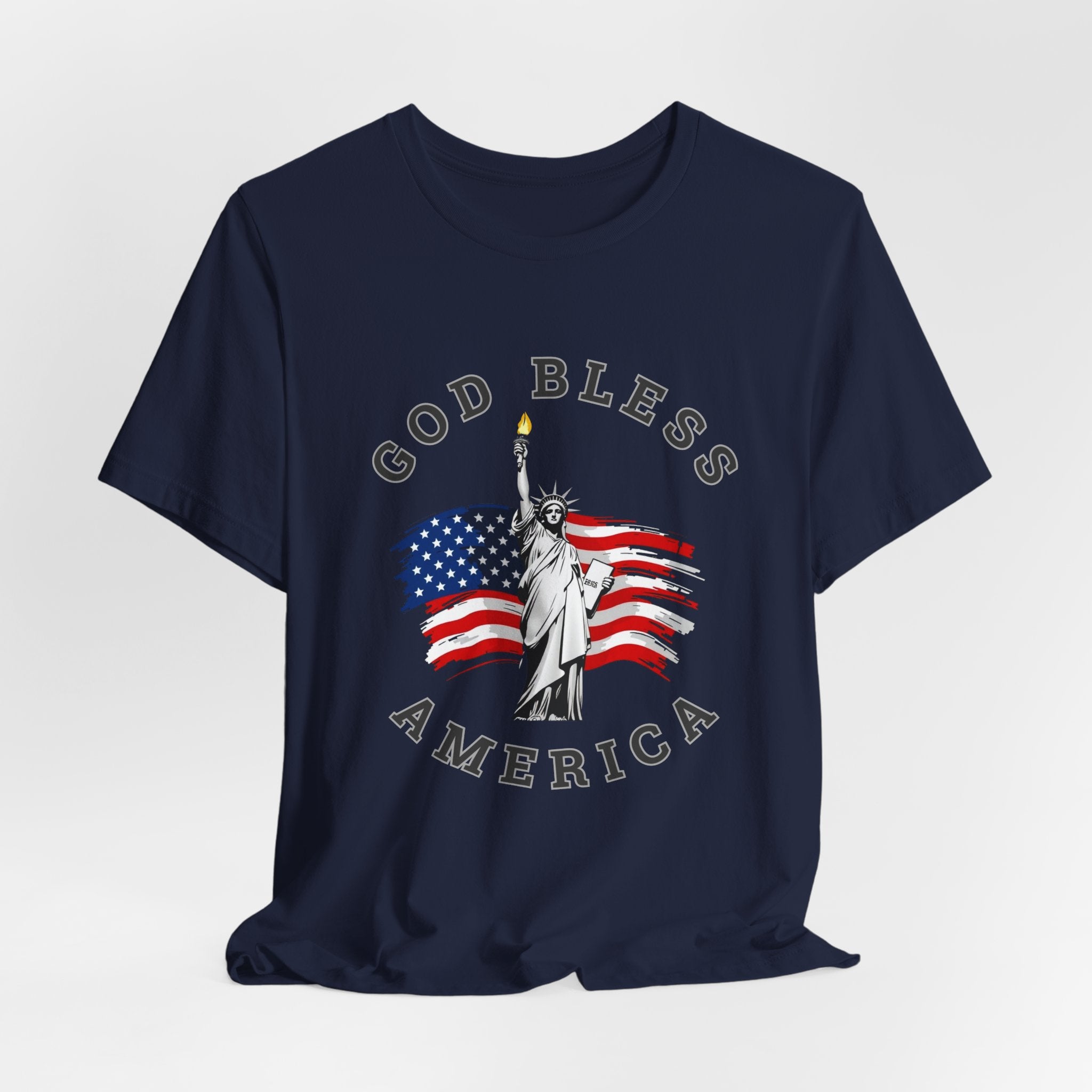 Navy blue t-shirt with 'God Bless America' graphic featuring the Statue of Liberty and American flag on a white background.