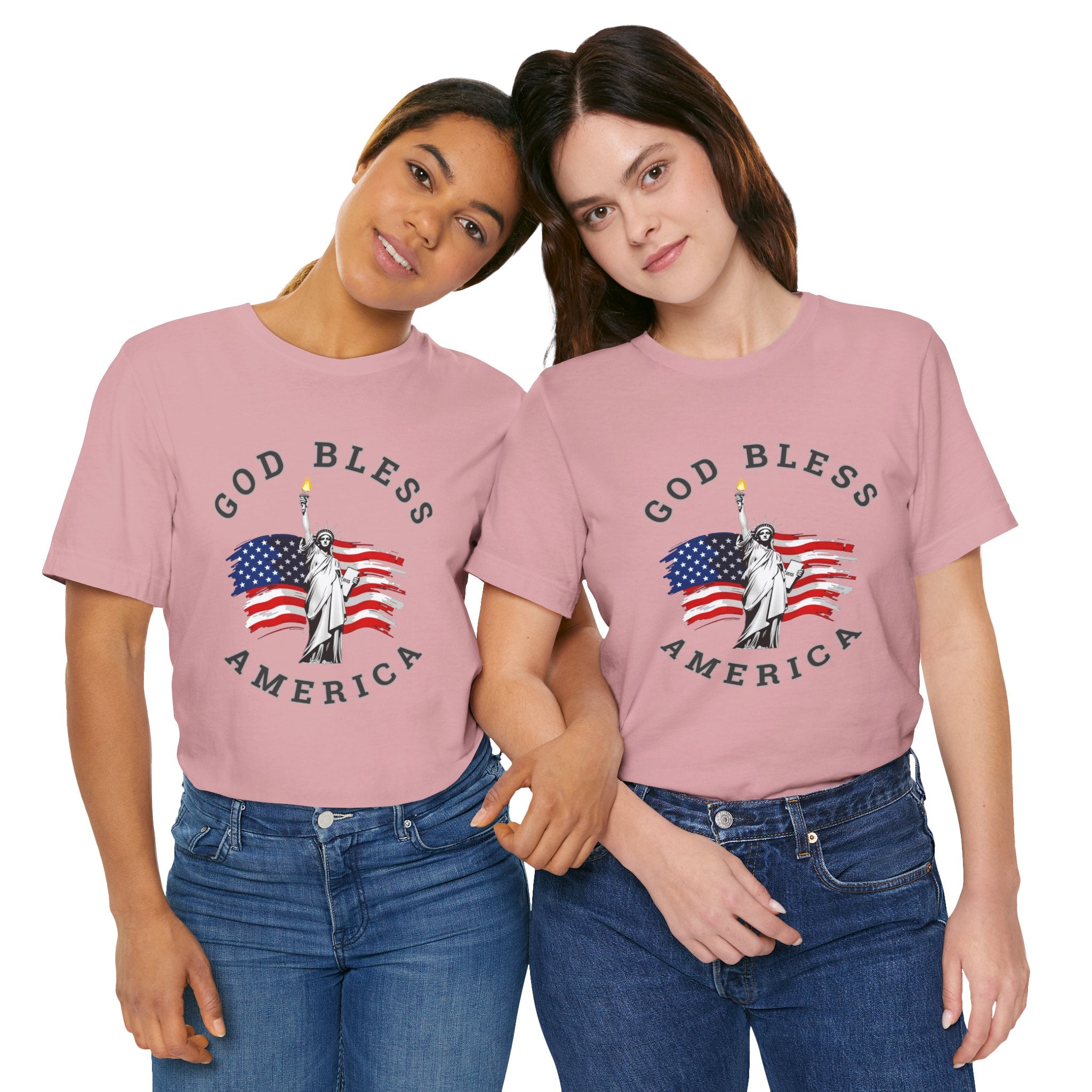 Two people wearing pink t-shirts with 'God Bless America' design on a white background