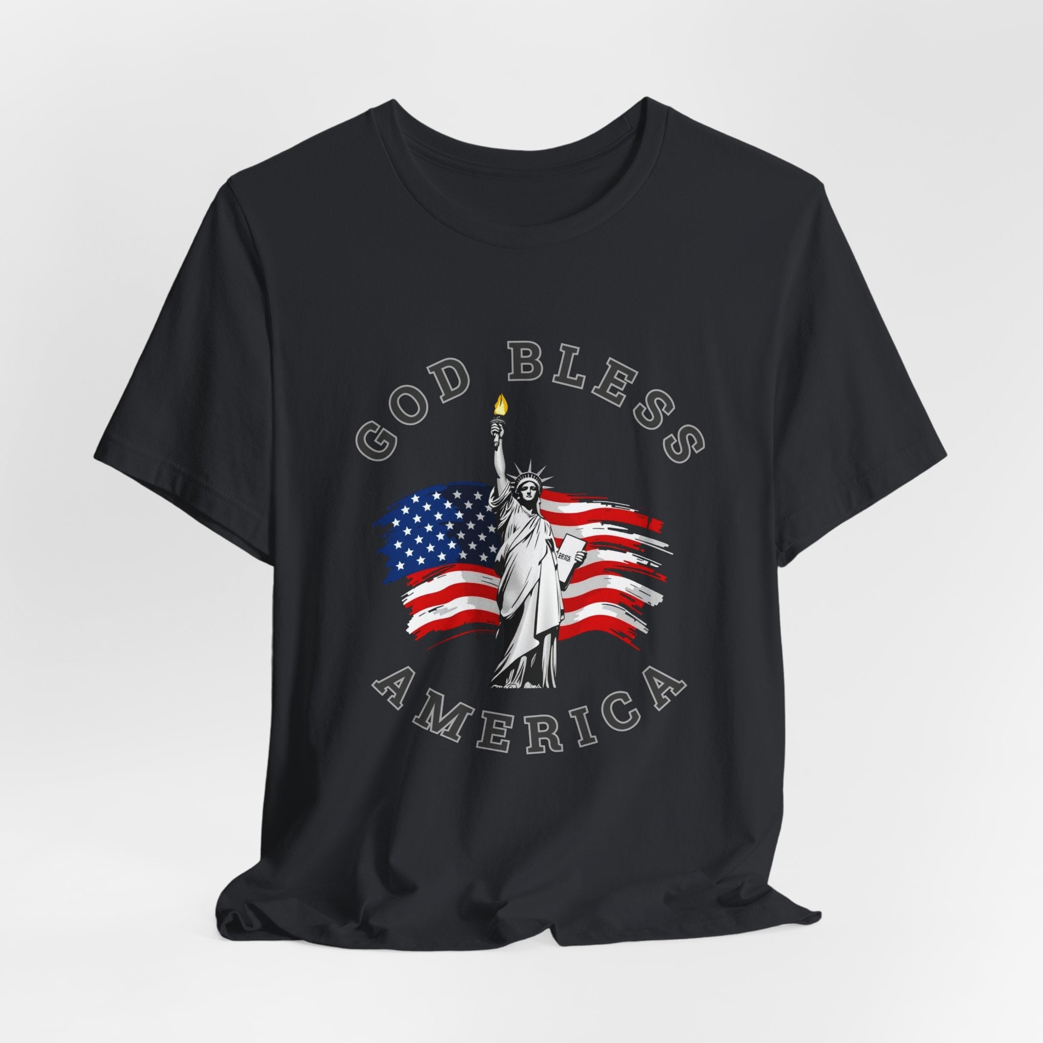 Vintage black t-shirt with 'God Bless America' design featuring the Statue of Liberty and American flag on a white background.