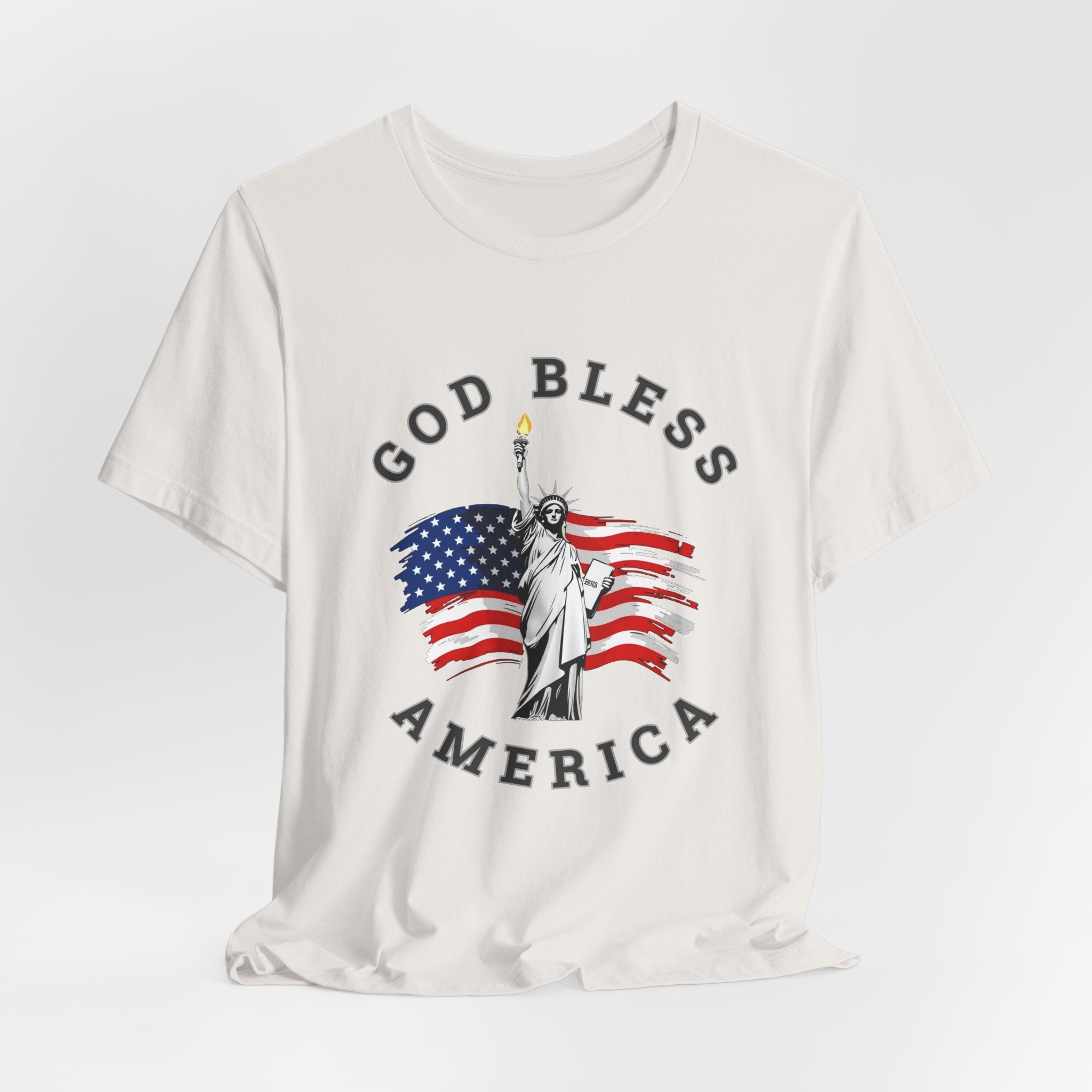 Vintage white t-shirt with 'God Bless America' graphic featuring the Statue of Liberty and American flag on a white background.
