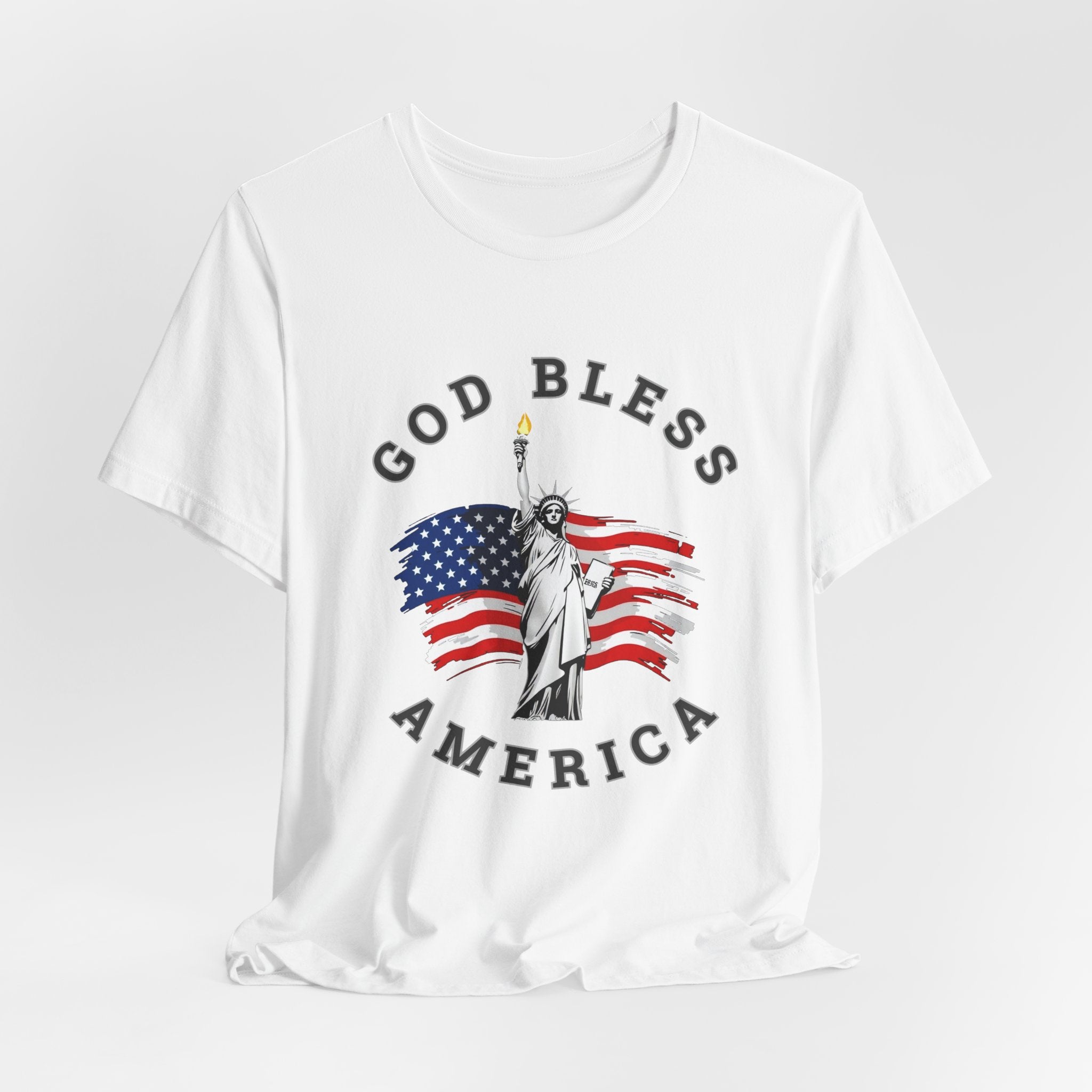 White t-shirt with 'God Bless America' graphic featuring the Statue of Liberty and American flag on a white background.