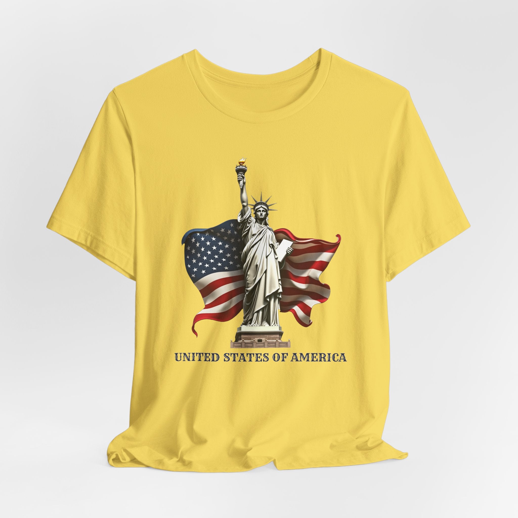 Maze yellow t-shirt with Statue of Liberty and American flag design on a white background