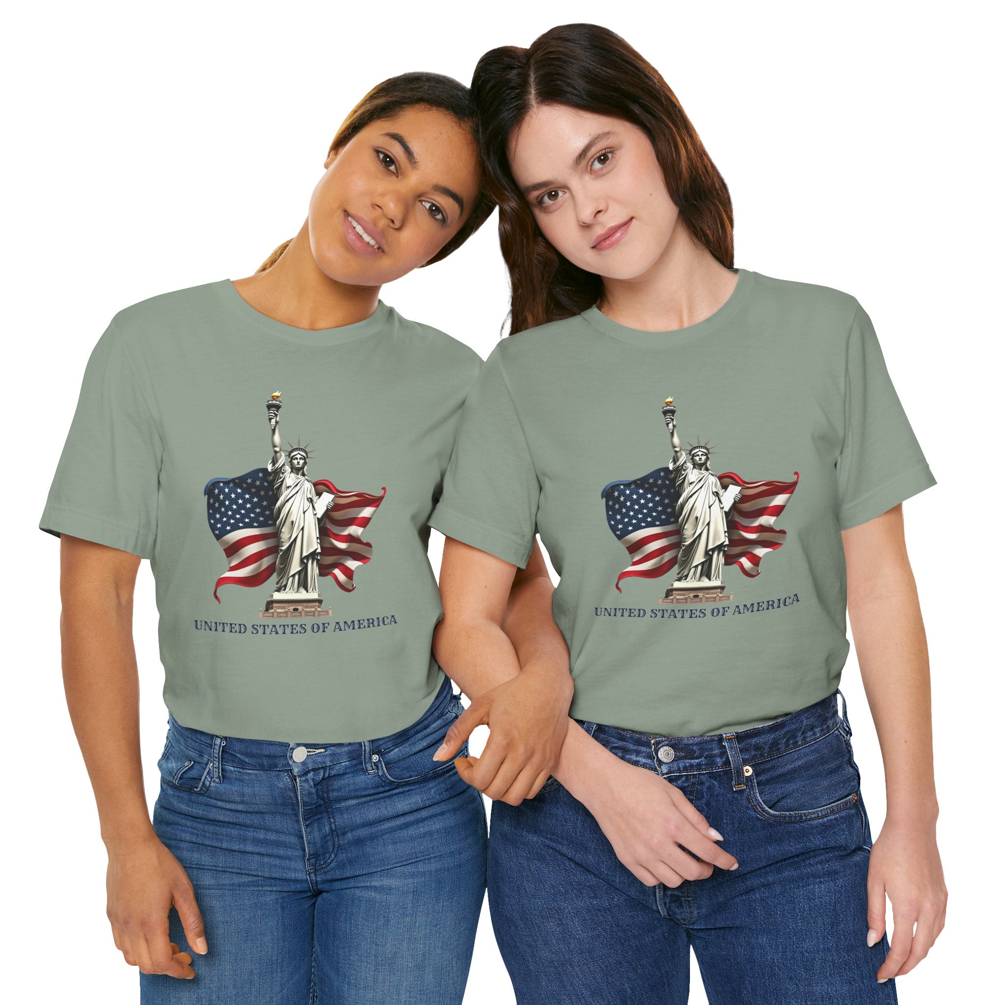 Two people wearing green t-shirts with a graphic of the Statue of Liberty and American flag.
