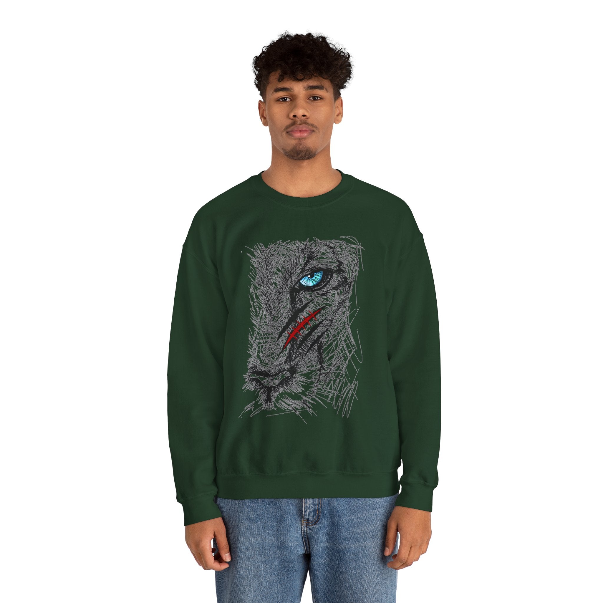 Person wearing a green sweatshirt with a blue eye lion face with scratch wound graphic design on a white background