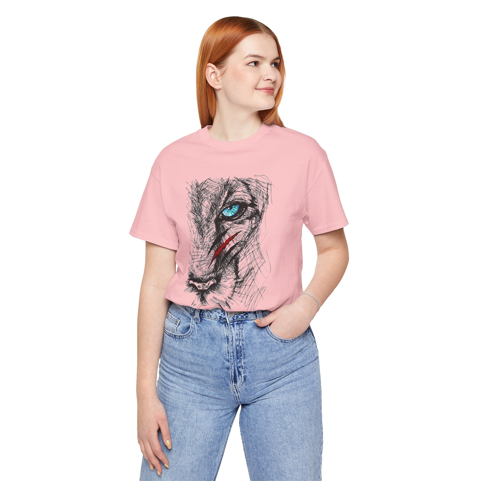 Person wearing a pink t-shirt with a graphic design on a white background