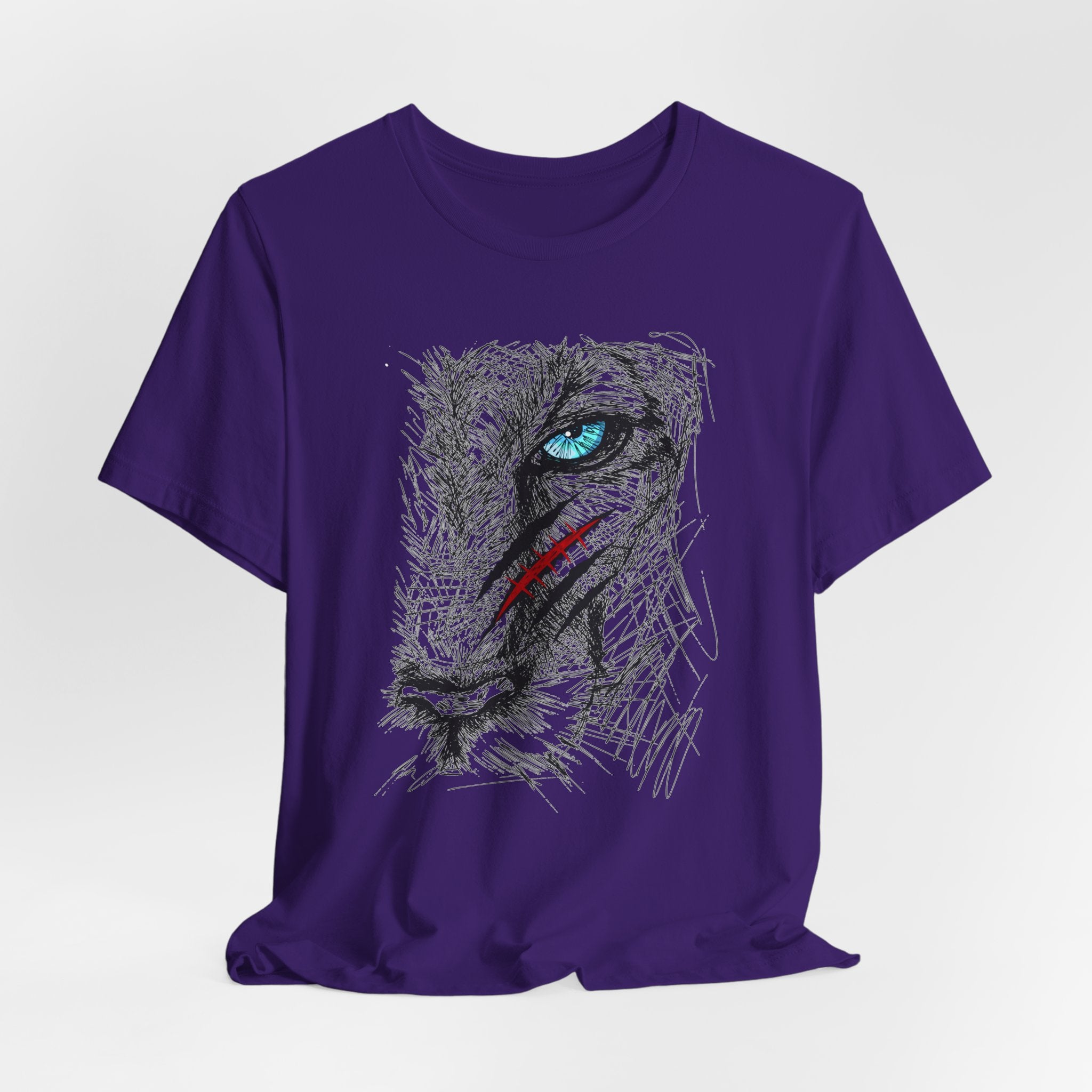 Team purple t-shirt with a graphic of a wounded lion's face with a blue eye