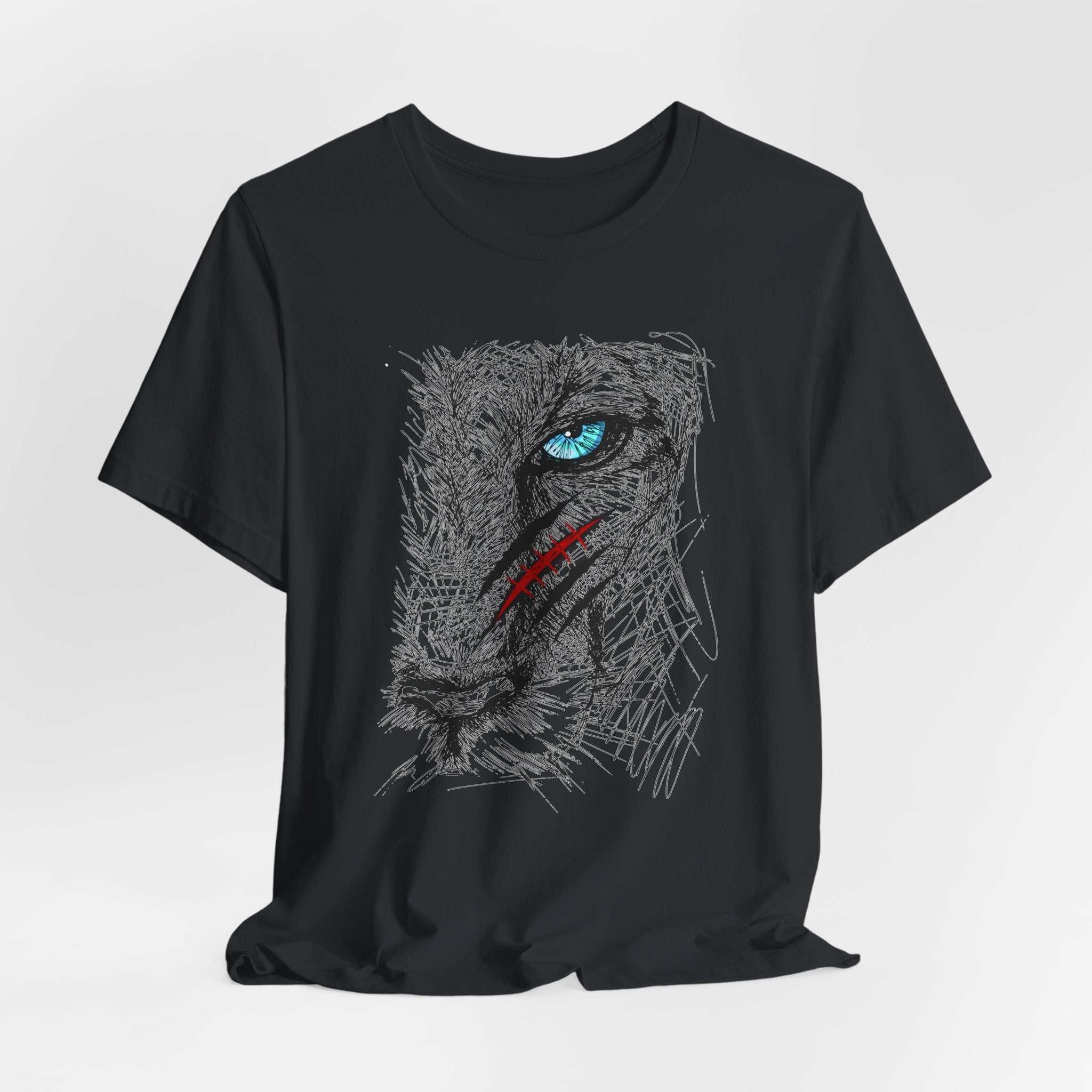 Vintage black t-shirt with a graphic of a wounded lion's face with a blue eye