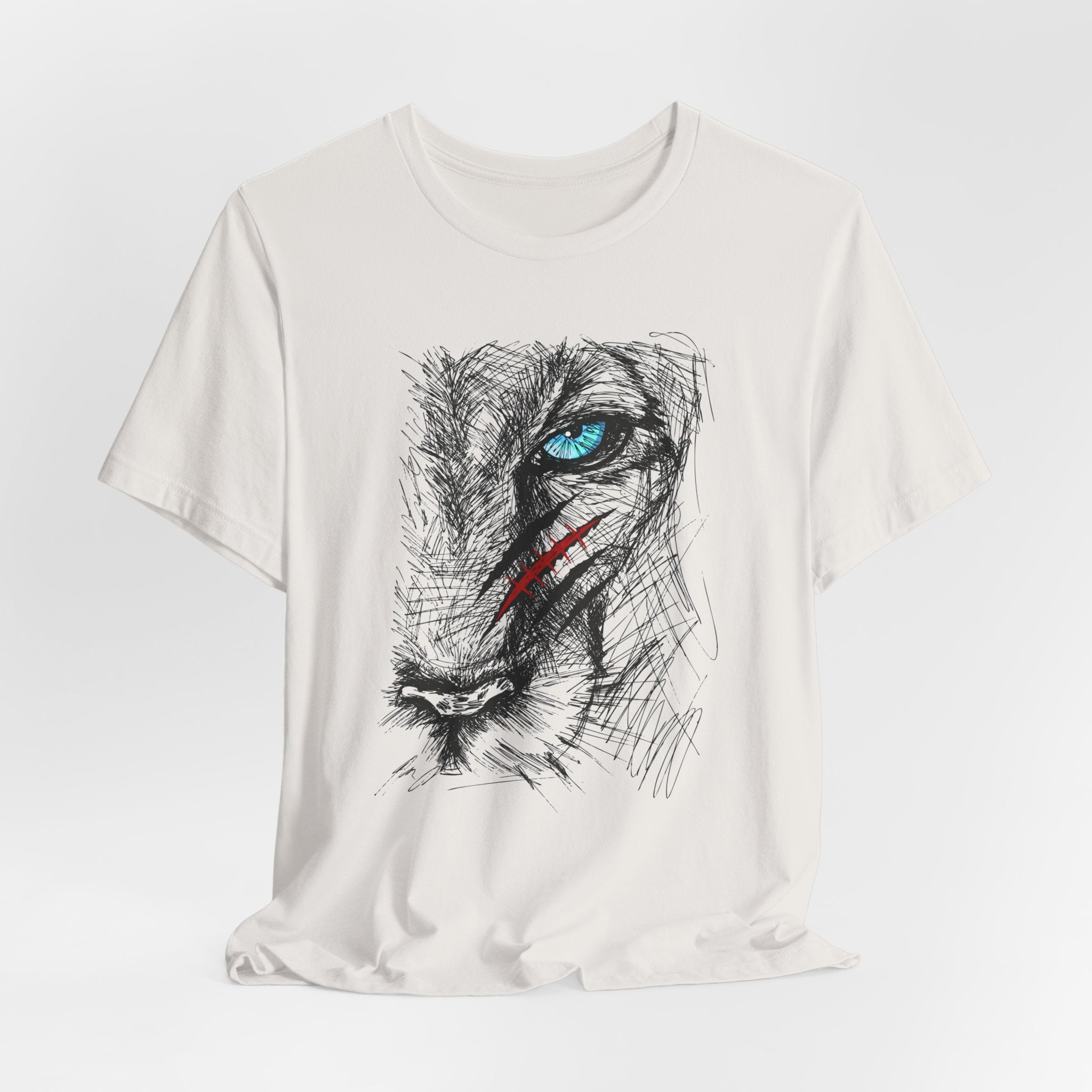 Vintage white t-shirt with a graphic of a wounded lion's face with a blue eye