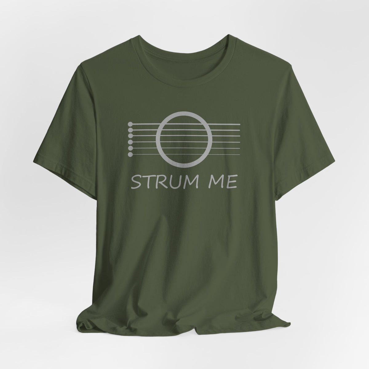 Military green t-shirt with 'STRUM ME' graphic on a white background