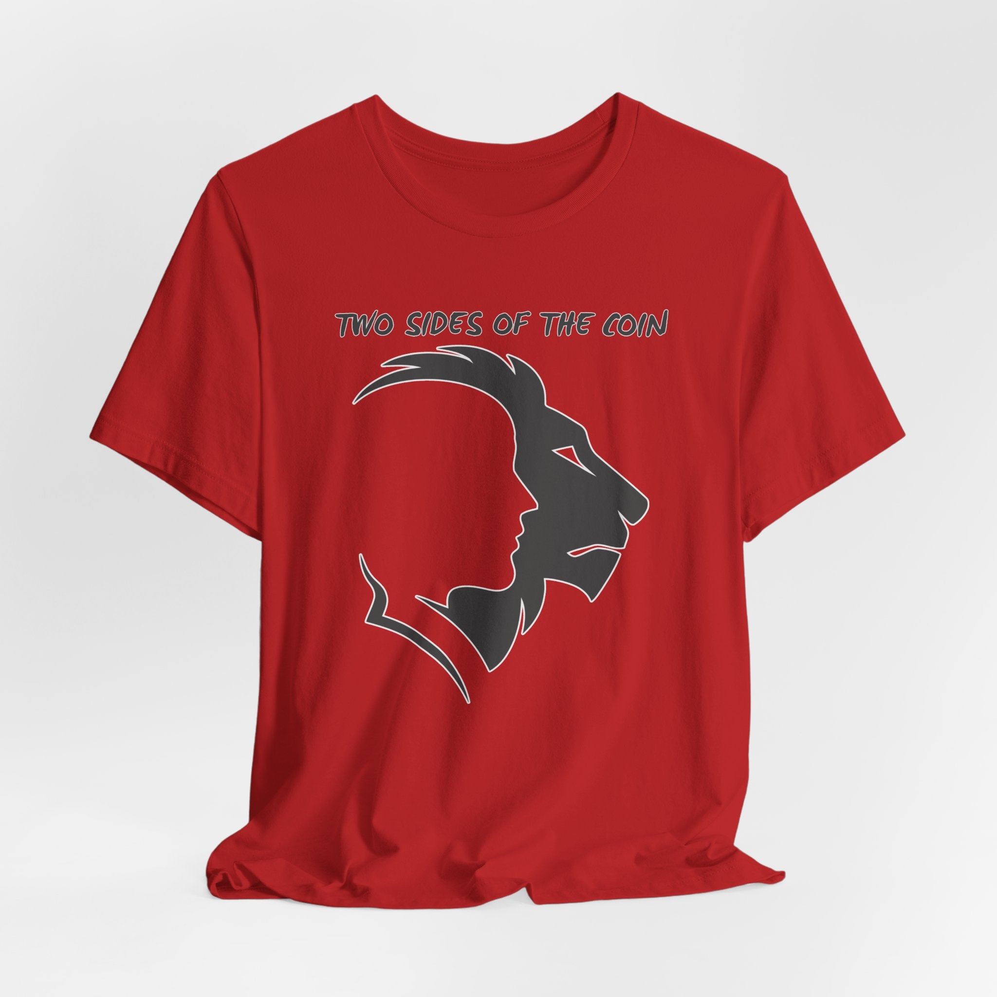 Red t-shirt with dark gray graphic of lion and human faces and text 'Two Sides of the Coin' on a light gray background