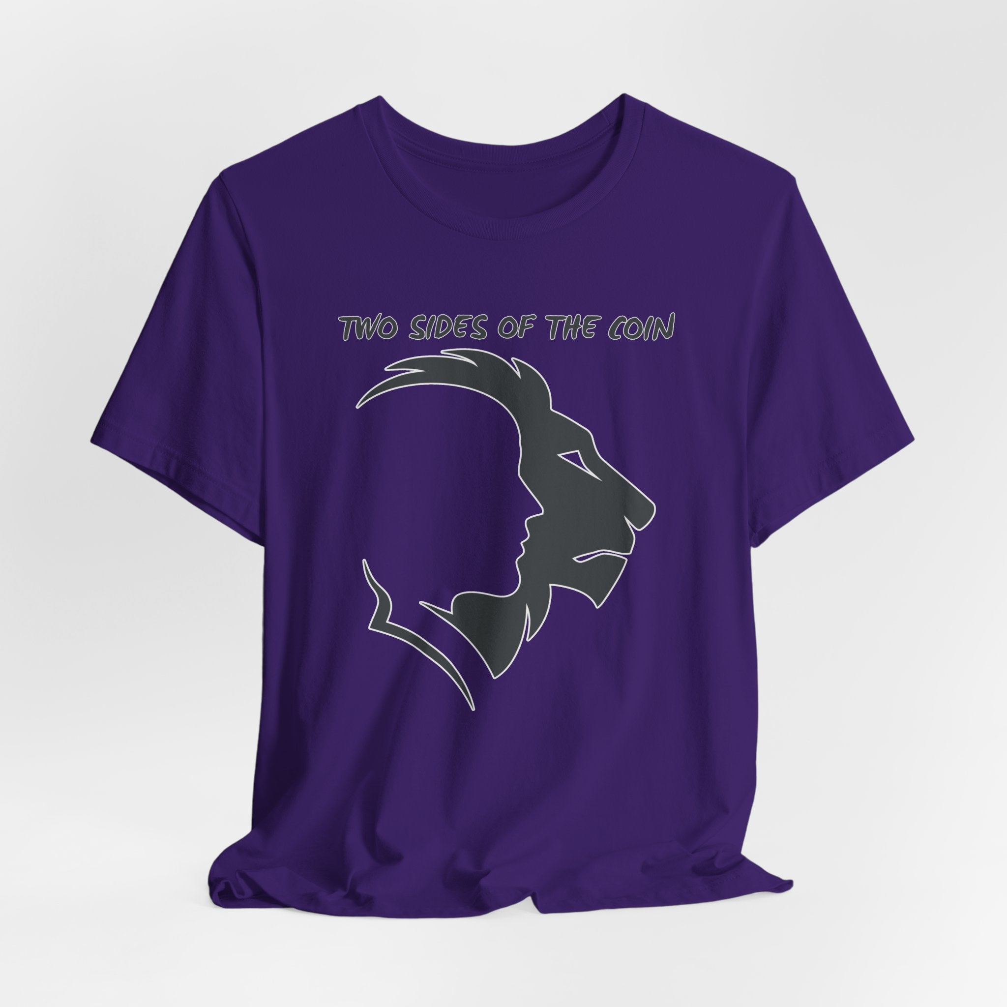 Team purple t-shirt with dark gray graphic of lion and human faces and text 'Two Sides of the Coin' on a light gray background
