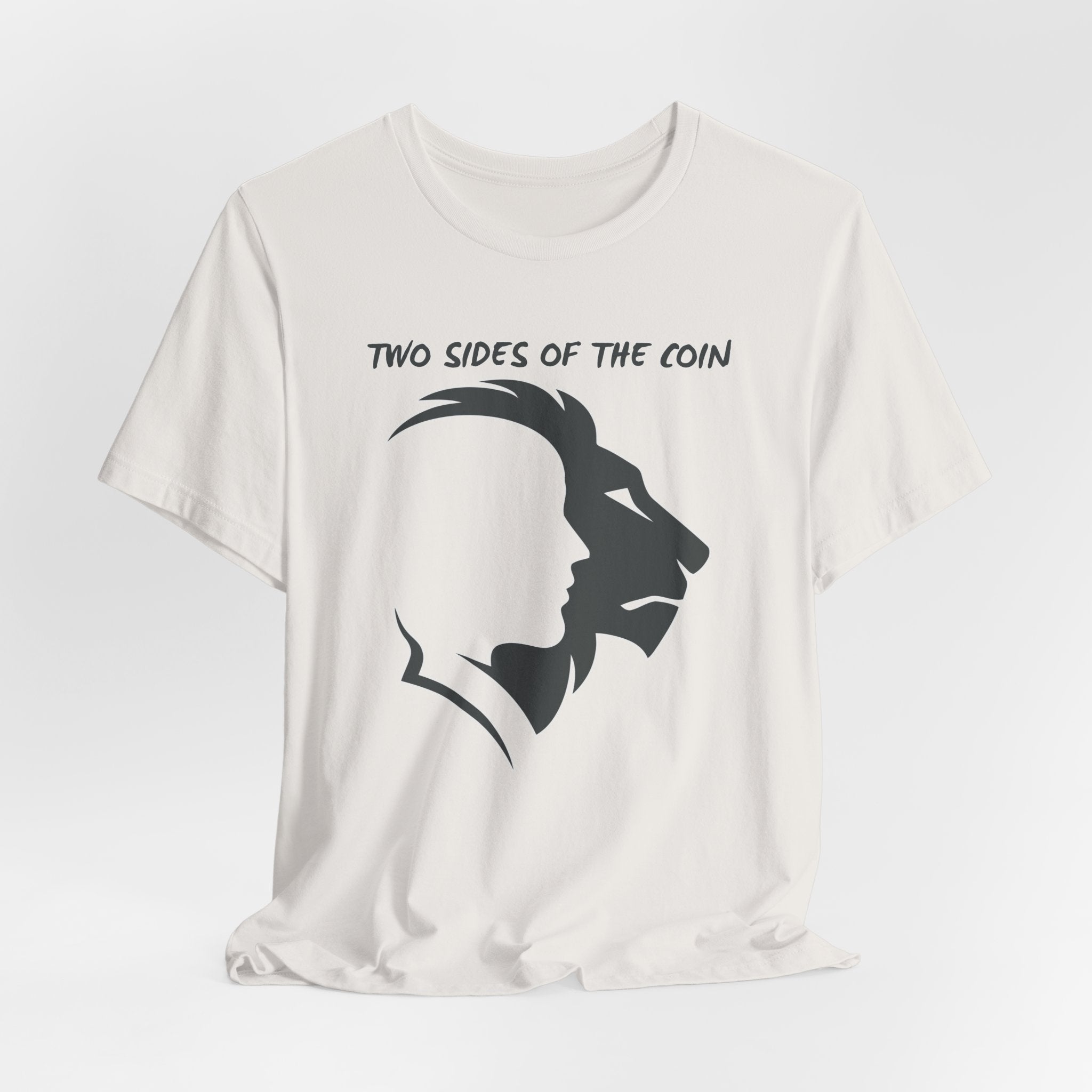 Vintage white t-shirt with dark gray graphic of lion and human faces and text 'Two Sides of the Coin' on a light gray background