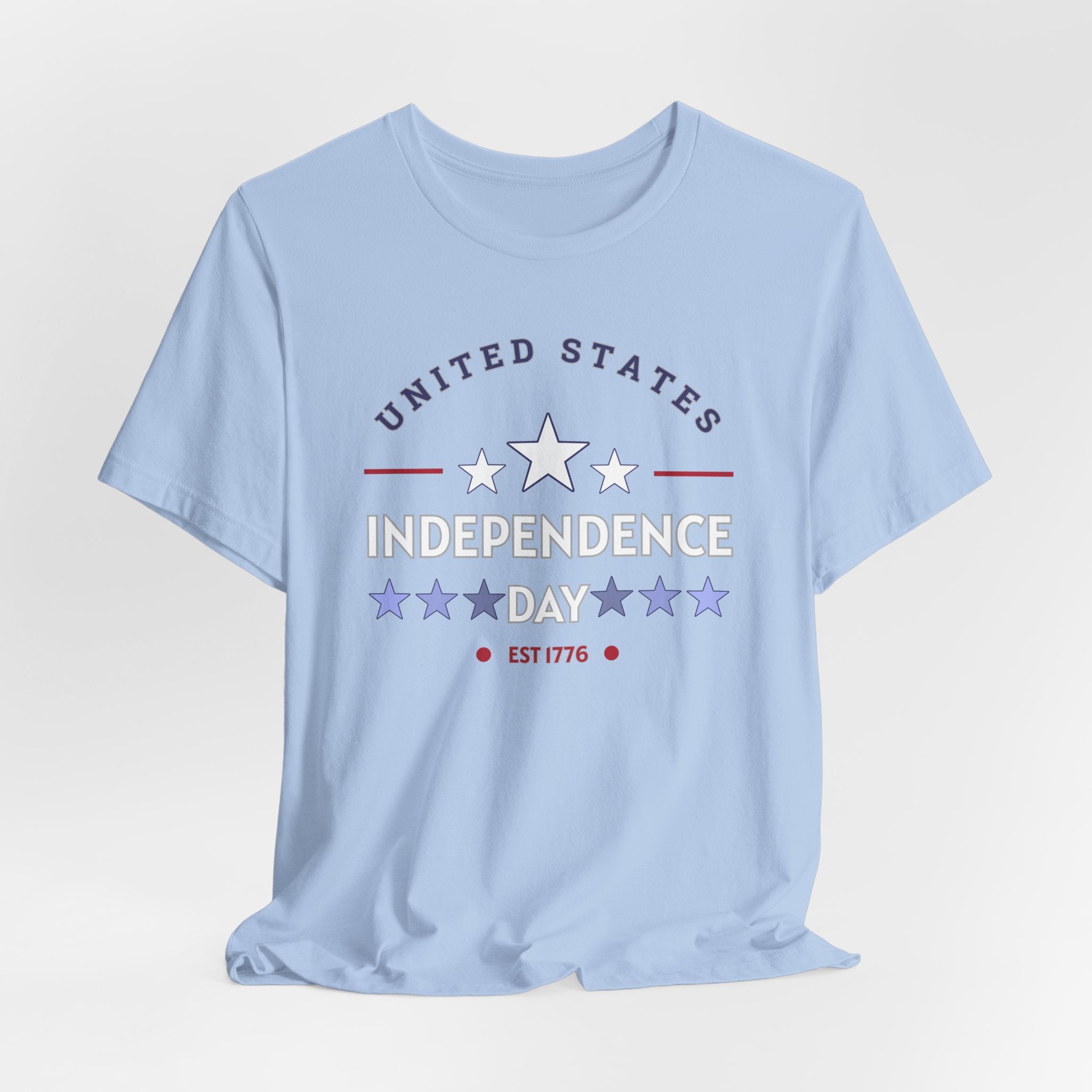 Light blue t-shirt with 'United States Independence Day' text and star graphics on a light gray background