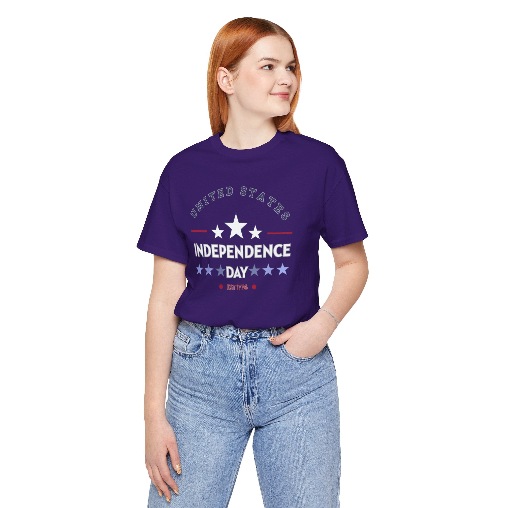 Person wearing a purple 'Independence Day' t-shirt on a white background