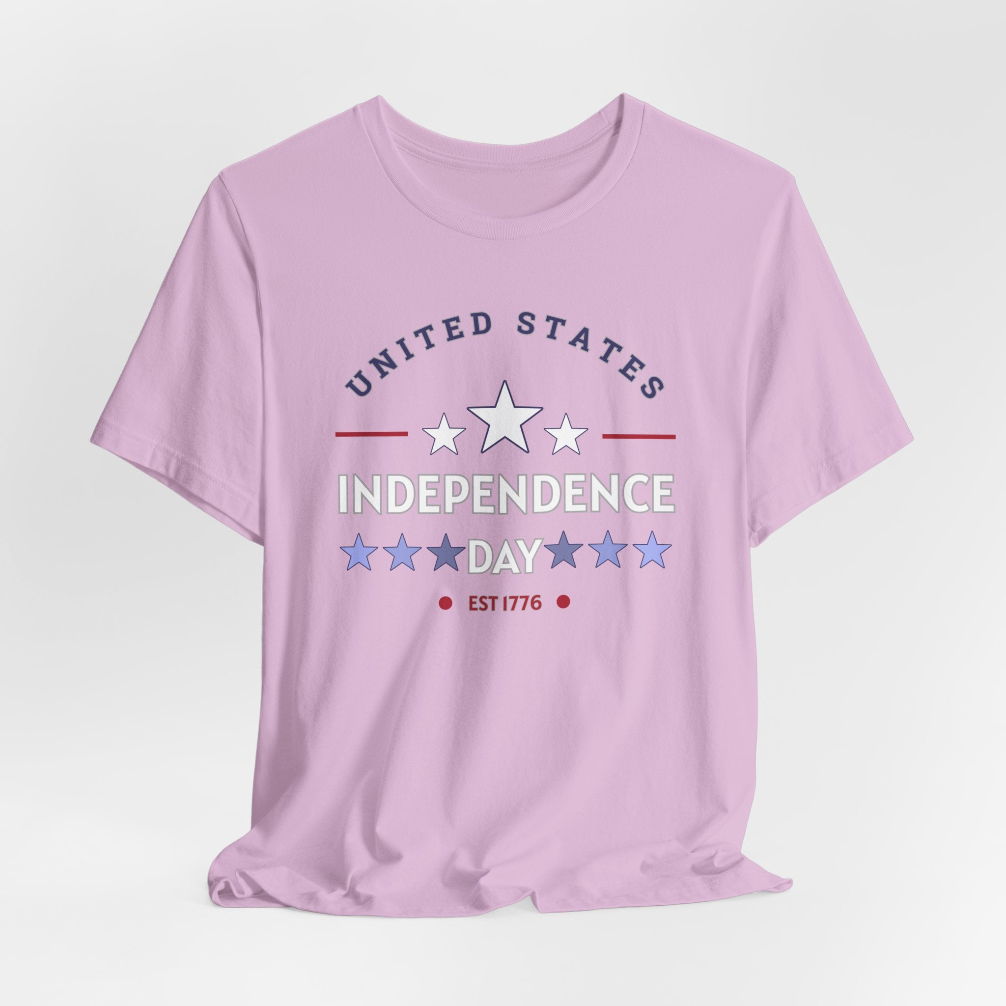 Lilac pink t-shirt with 'United States Independence Day' text and star graphics on a light gray background