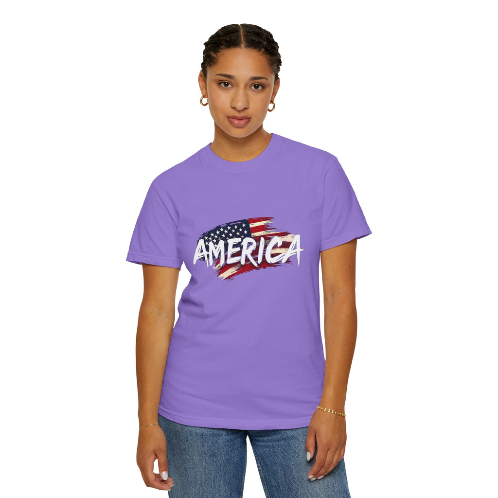 Person wearing a purple t-shirt with an American flag design and the word 'AMERICA'.
