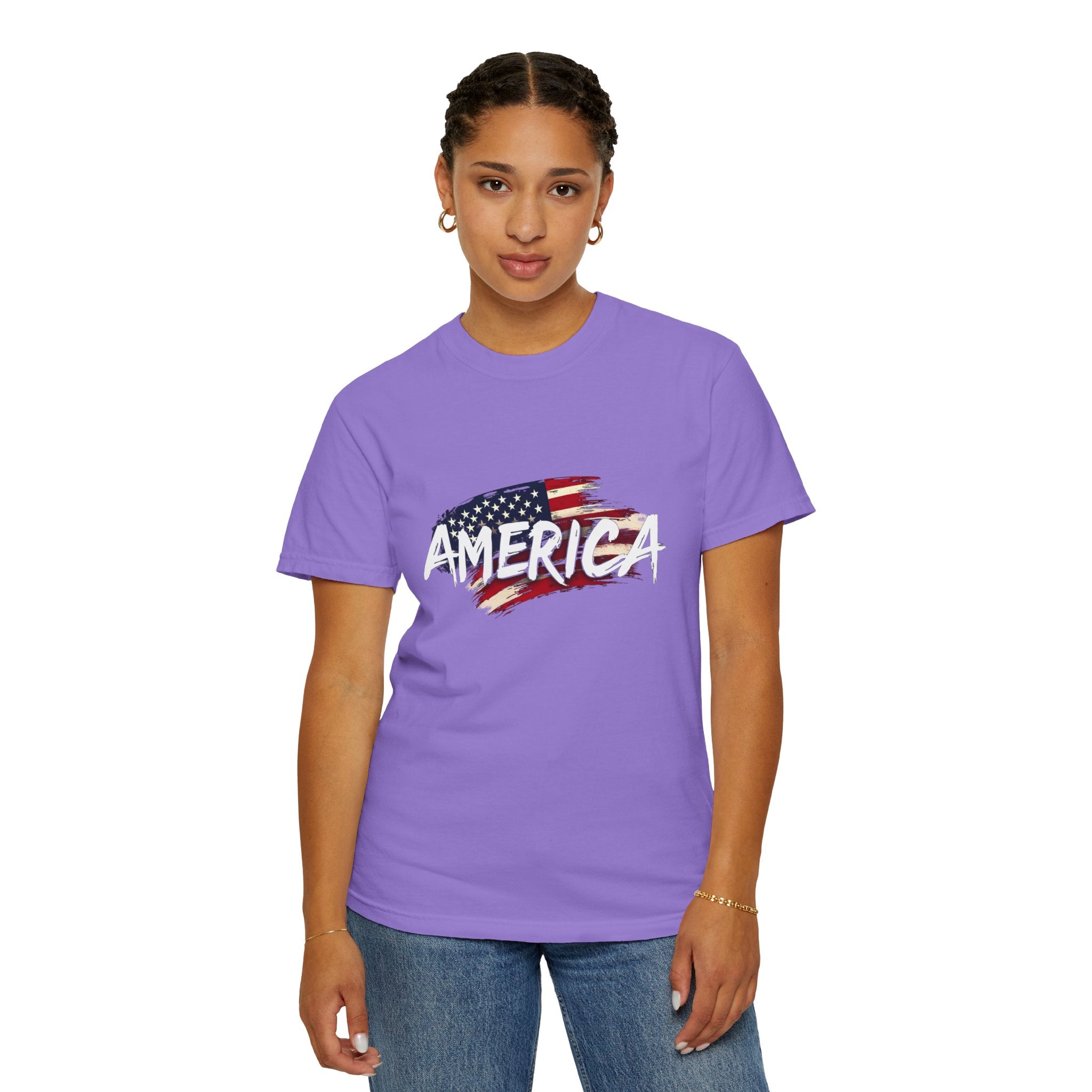 Person wearing a purple t-shirt with an American flag design and the word 'AMERICA'.