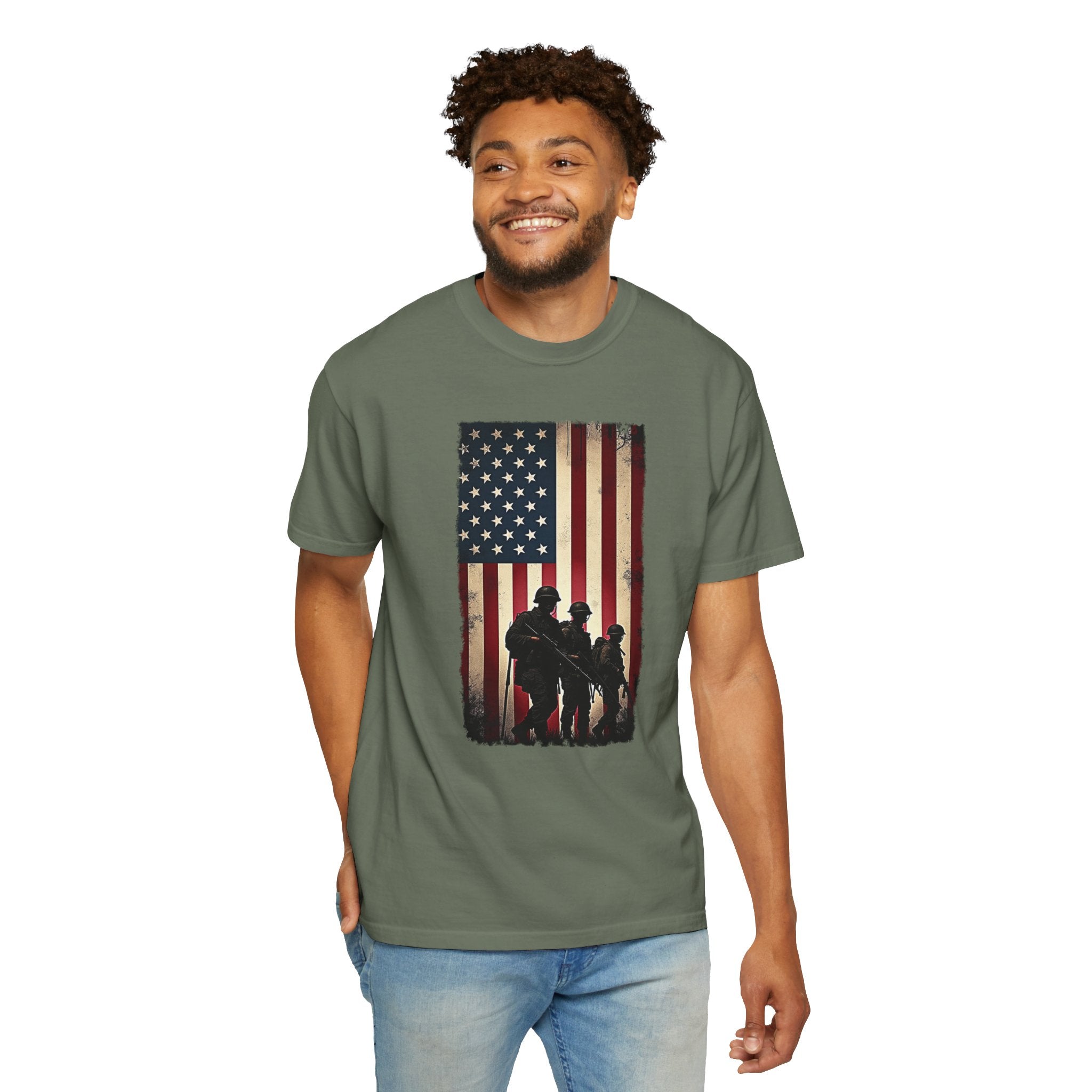 Man wearing a green t-shirt with an American flag and three soldiers graphic on a white background