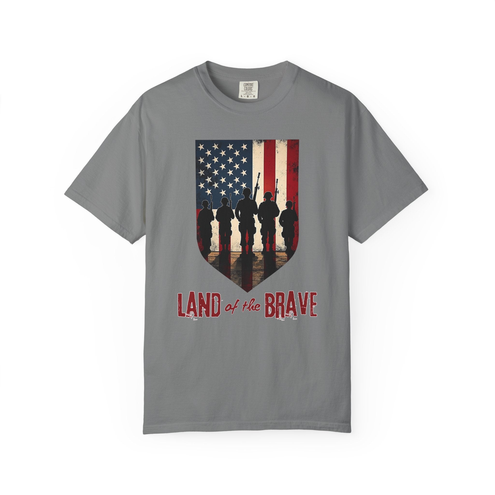 Grey t-shirt with American flag and soldiers graphic, 'Land of the Brave' text on a white background