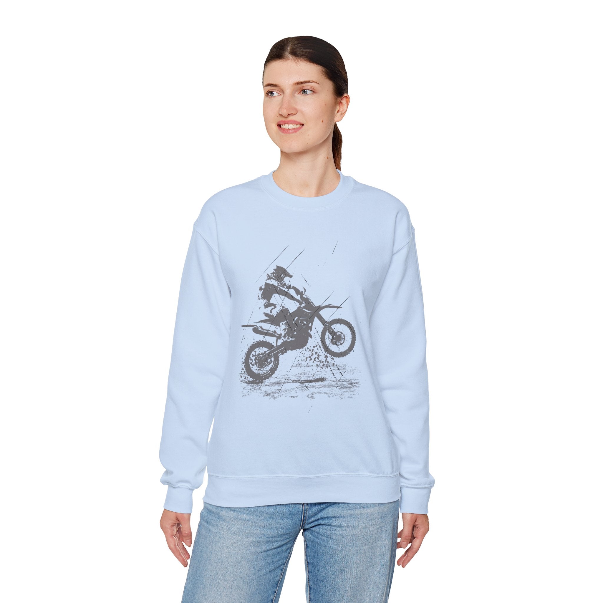 Woman wearing a light blue sweatshirt with a graphic design on a white background