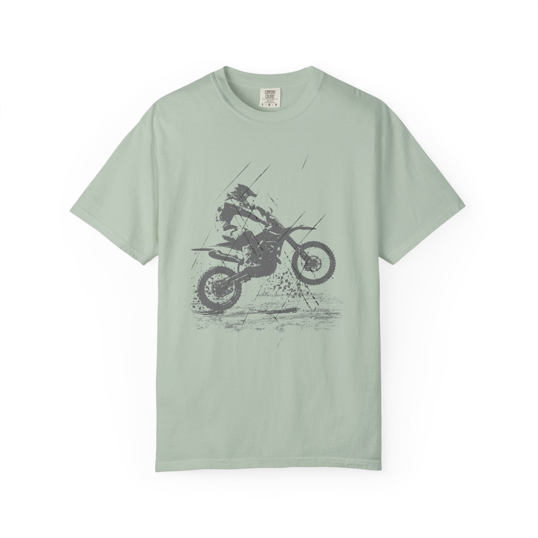 Bay light green t-shirt with a vintage graphic of a person on a muddy motorcycle  on a white background