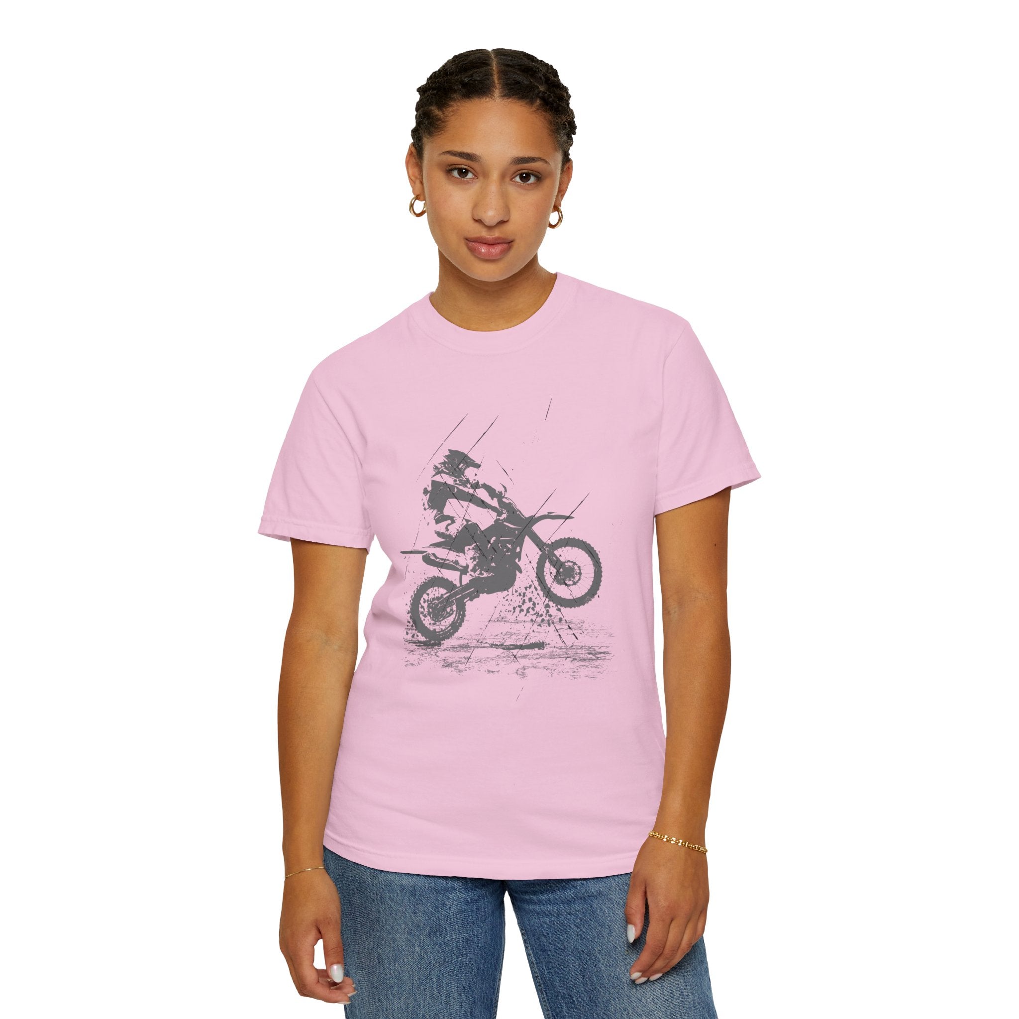 Person wearing a pink t-shirt with a graphic design on a white background