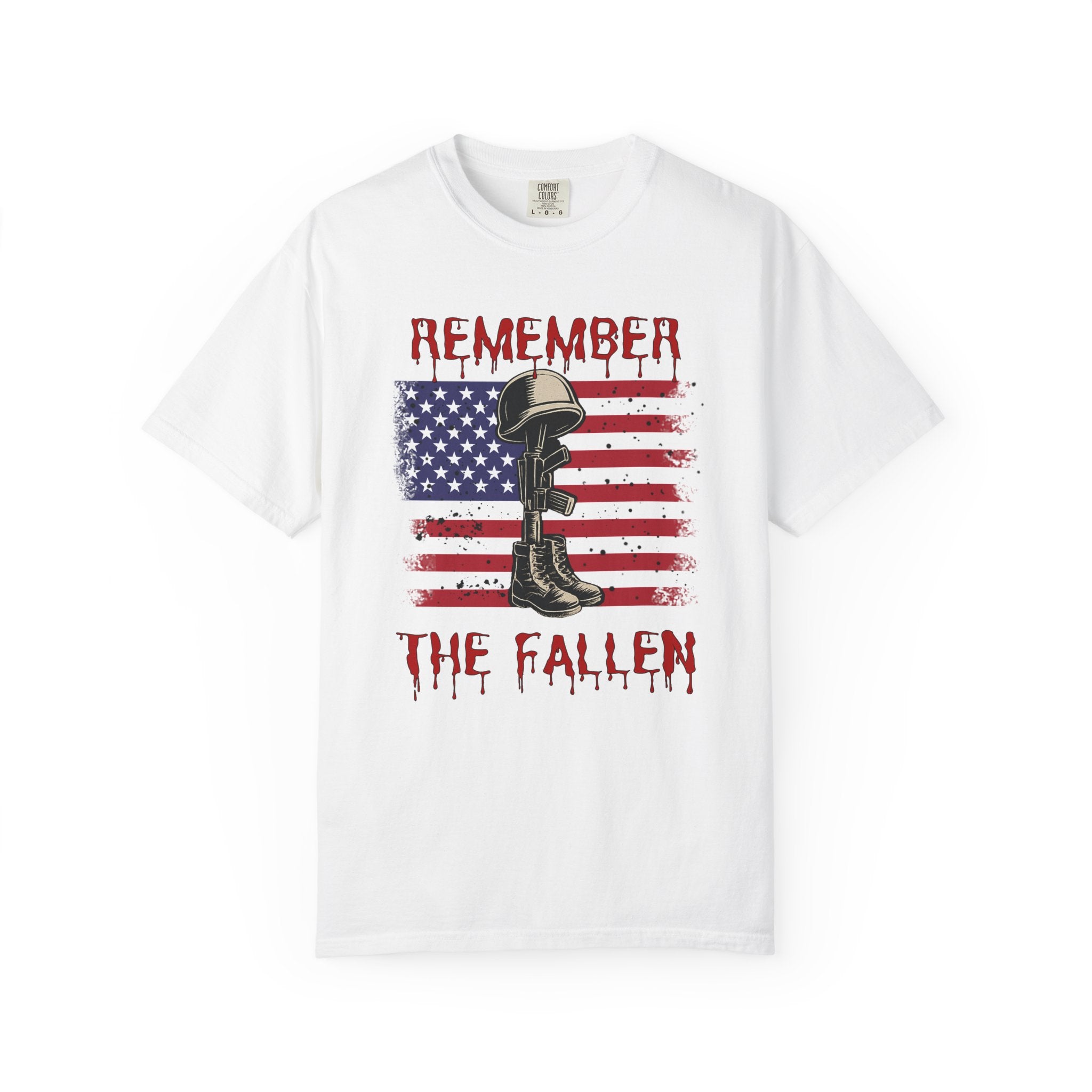 White t-shirt with American flag, helmet, and boots graphic and 'Remember the Fallen' text on a white background.