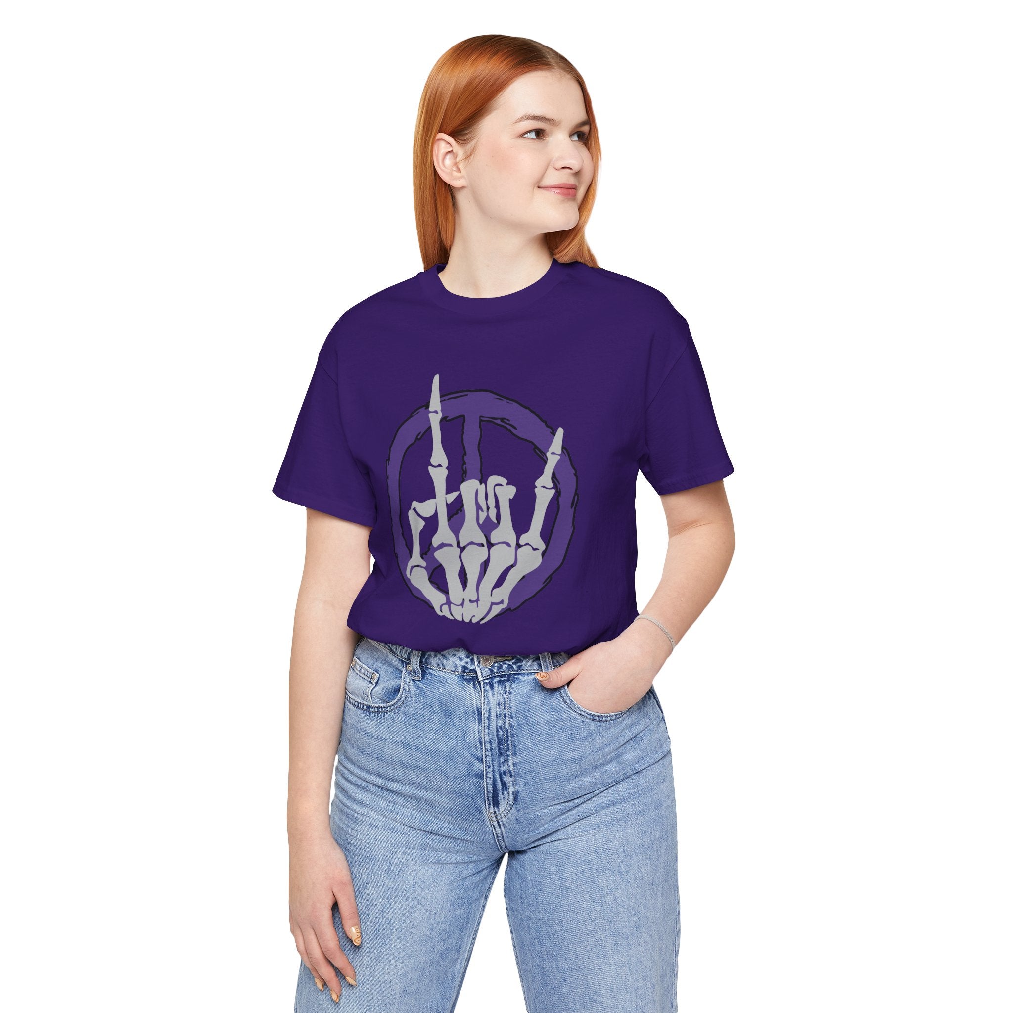 Person wearing a purple t-shirt with a skeleton hand design on a white background