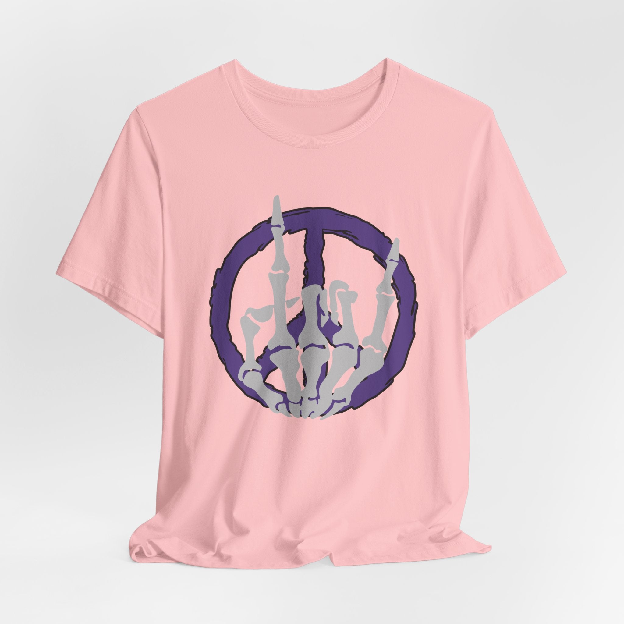 Pink t-shirt with a cool skeleton symbol in a purple peace sign design on a light gray background