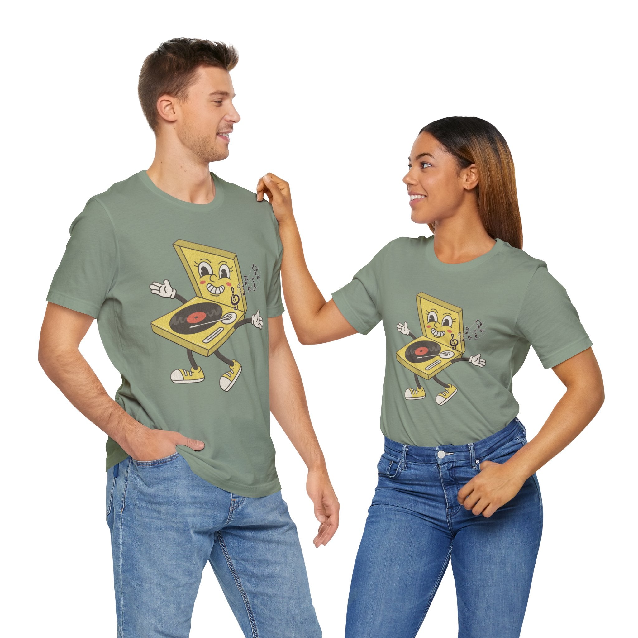 Two people wearing matching green t-shirts with a cartoon design on a white background