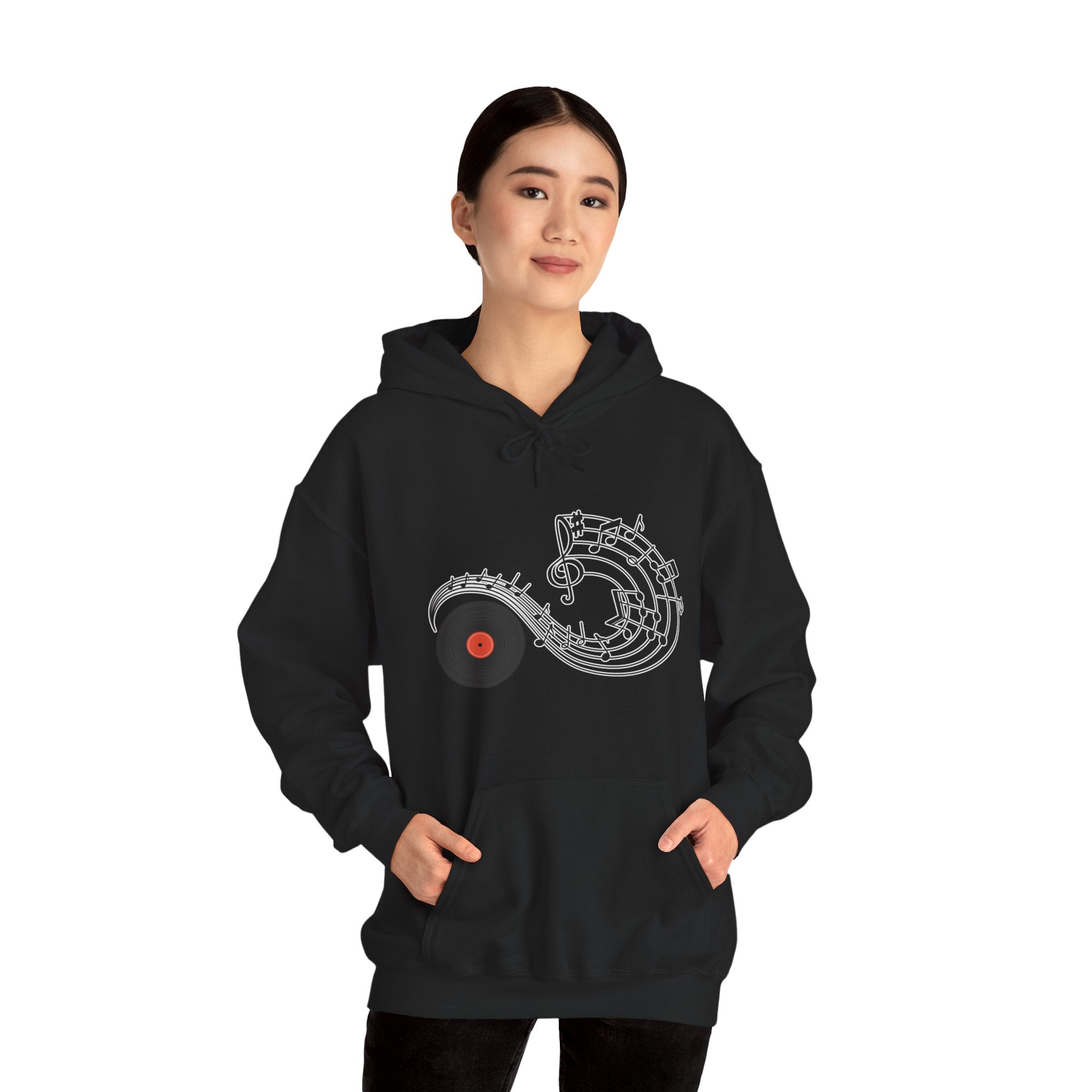 Person wearing a black hoodie with a unique design on a white background