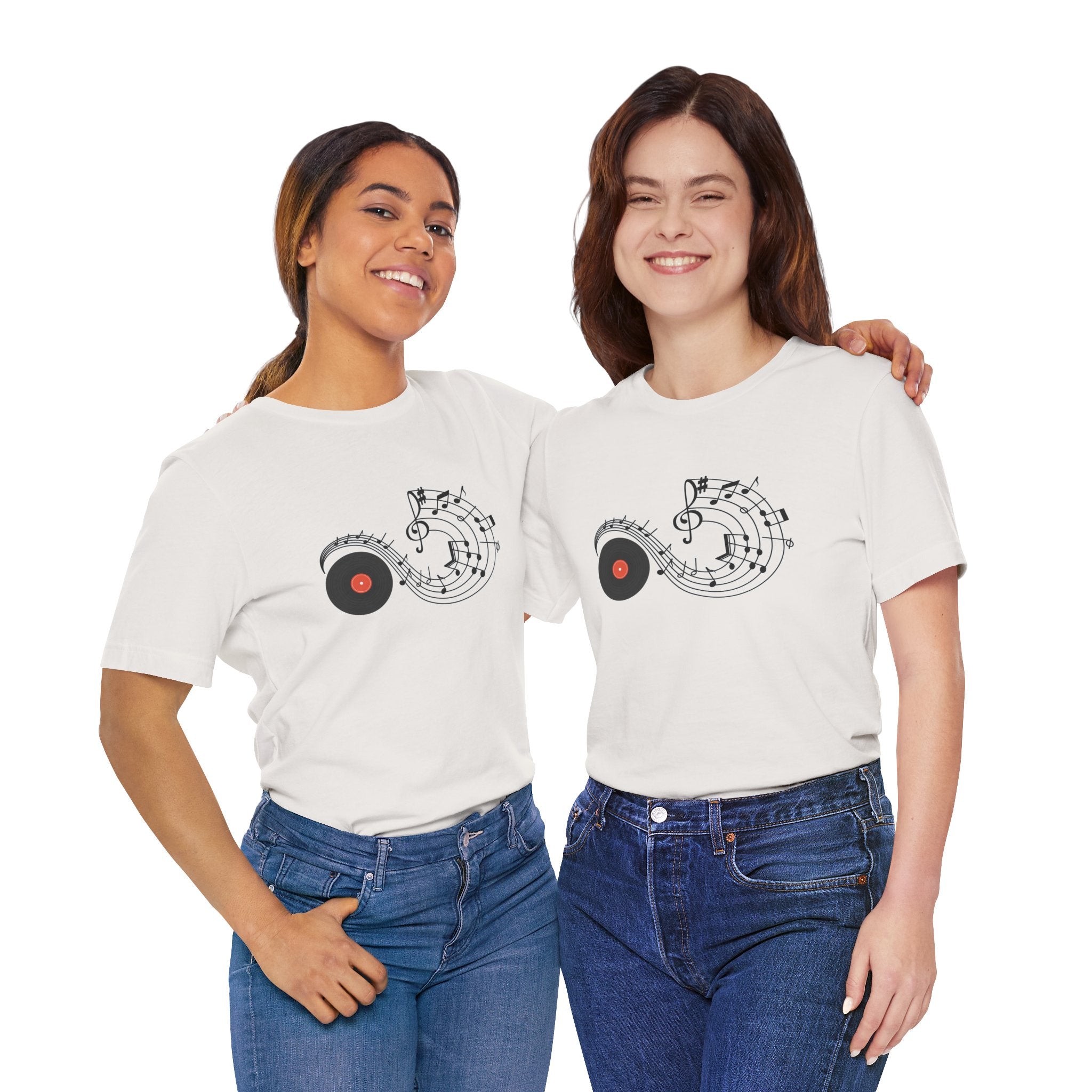 Two women wearing white t-shirts with music-themed designs on a white background