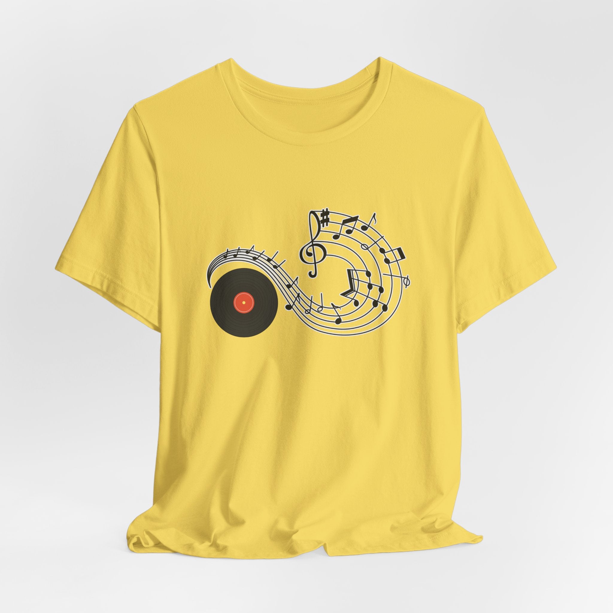 Yellow t-shirt with music-themed design on a white background
