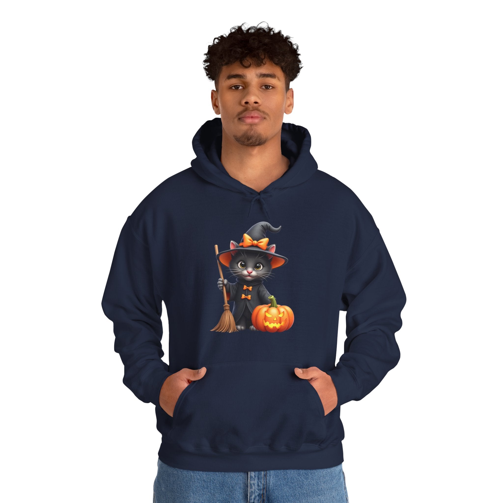 Person wearing a navy hoodie with a Halloween design of a cat in a witch hat, broom, and pumpkin.