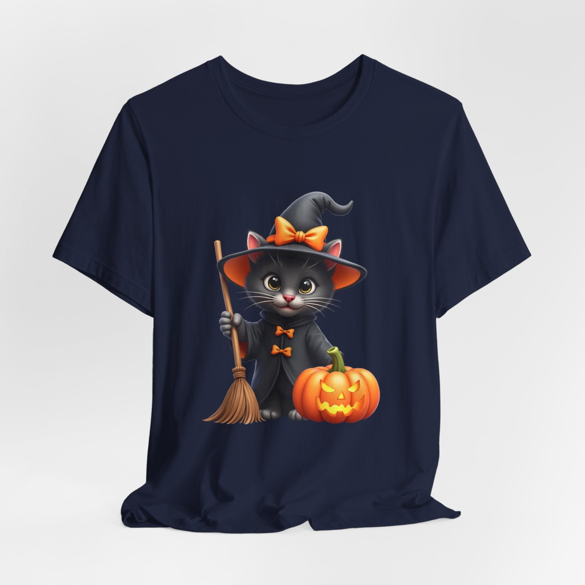 Navy blue t-shirt with a Halloween-themed design of a cat in a witch costume, broom, and pumpkin on a white background.