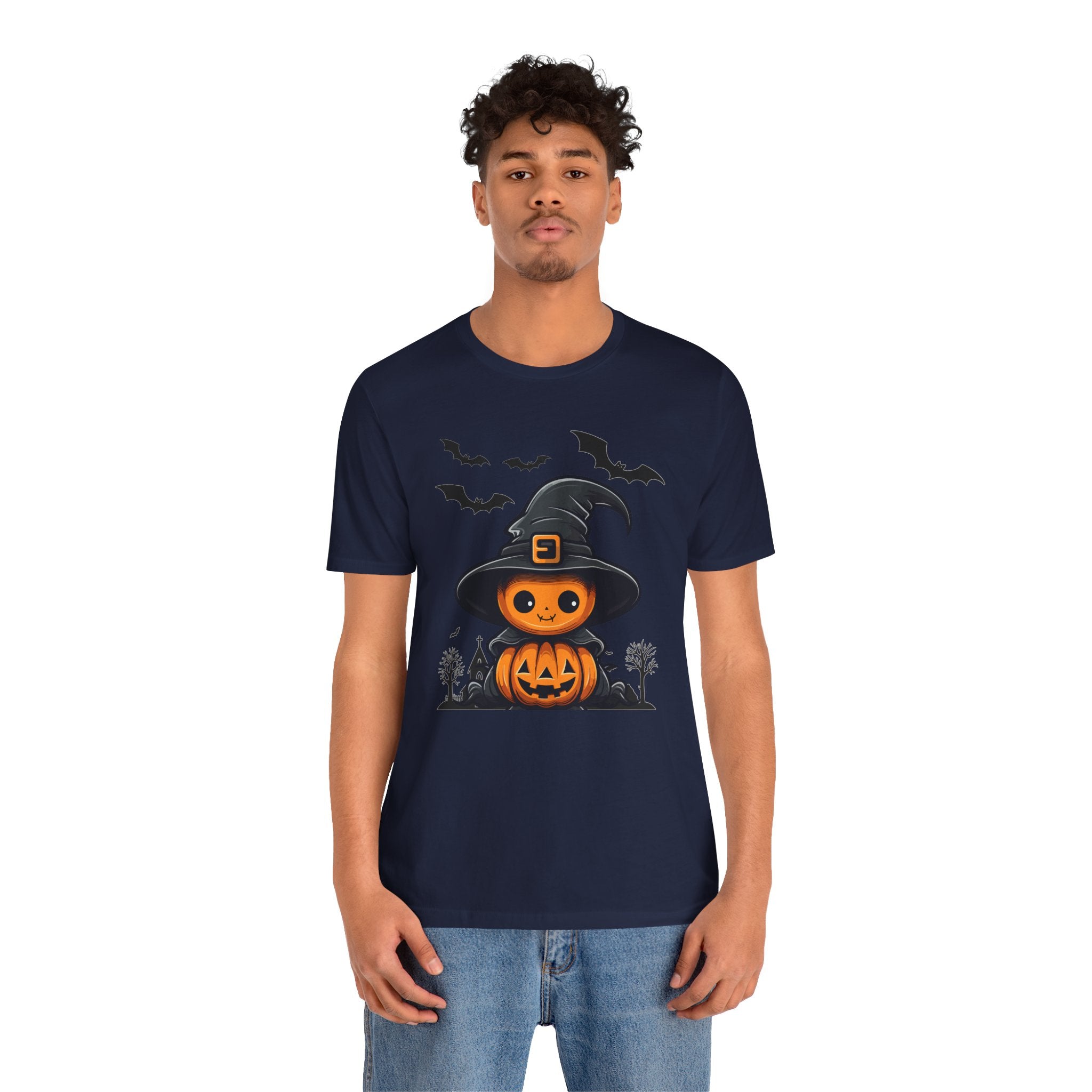 Person wearing a navy blue t-shirt with a Halloween-themed design on a white background