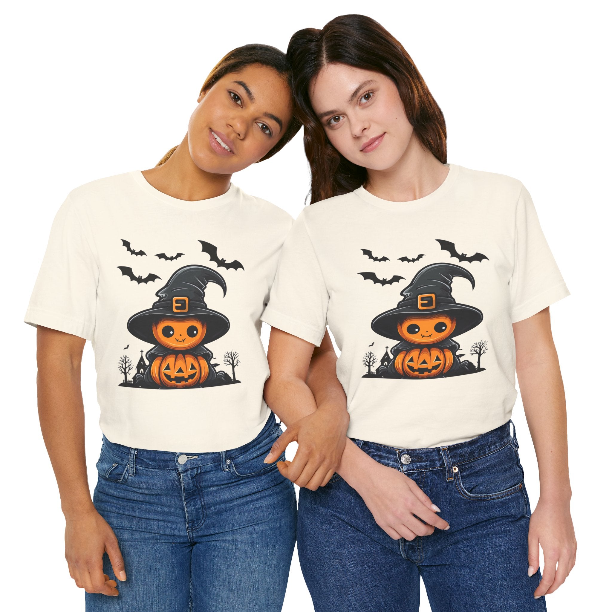 Two people wearing Halloween-themed t-shirts with a pumpkin and witch hat design.